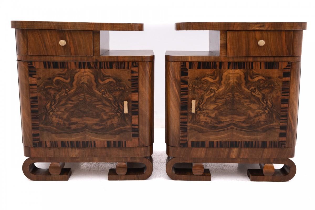 Polish A pair of Art Deco walnut bedside tables.