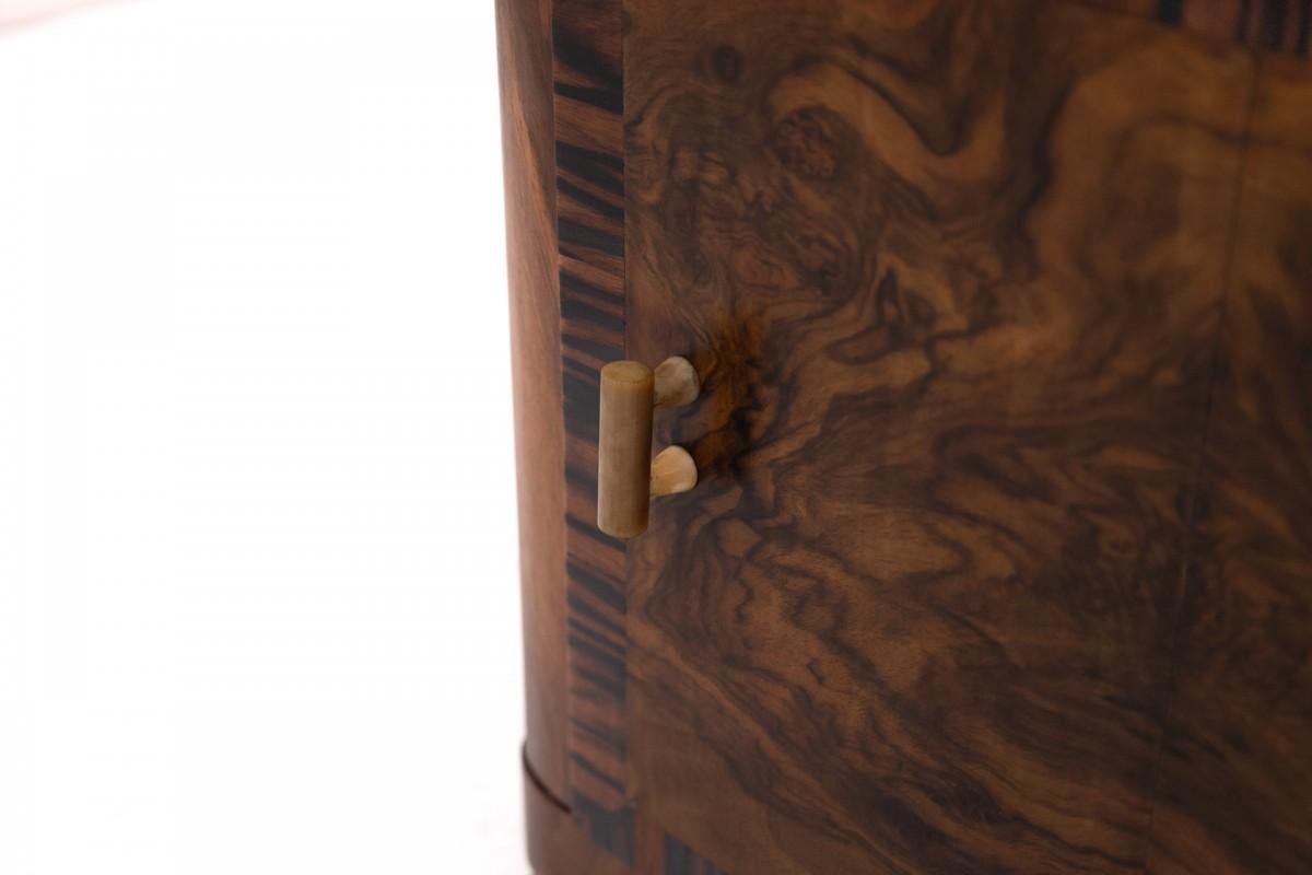 A pair of Art Deco walnut bedside tables. 3