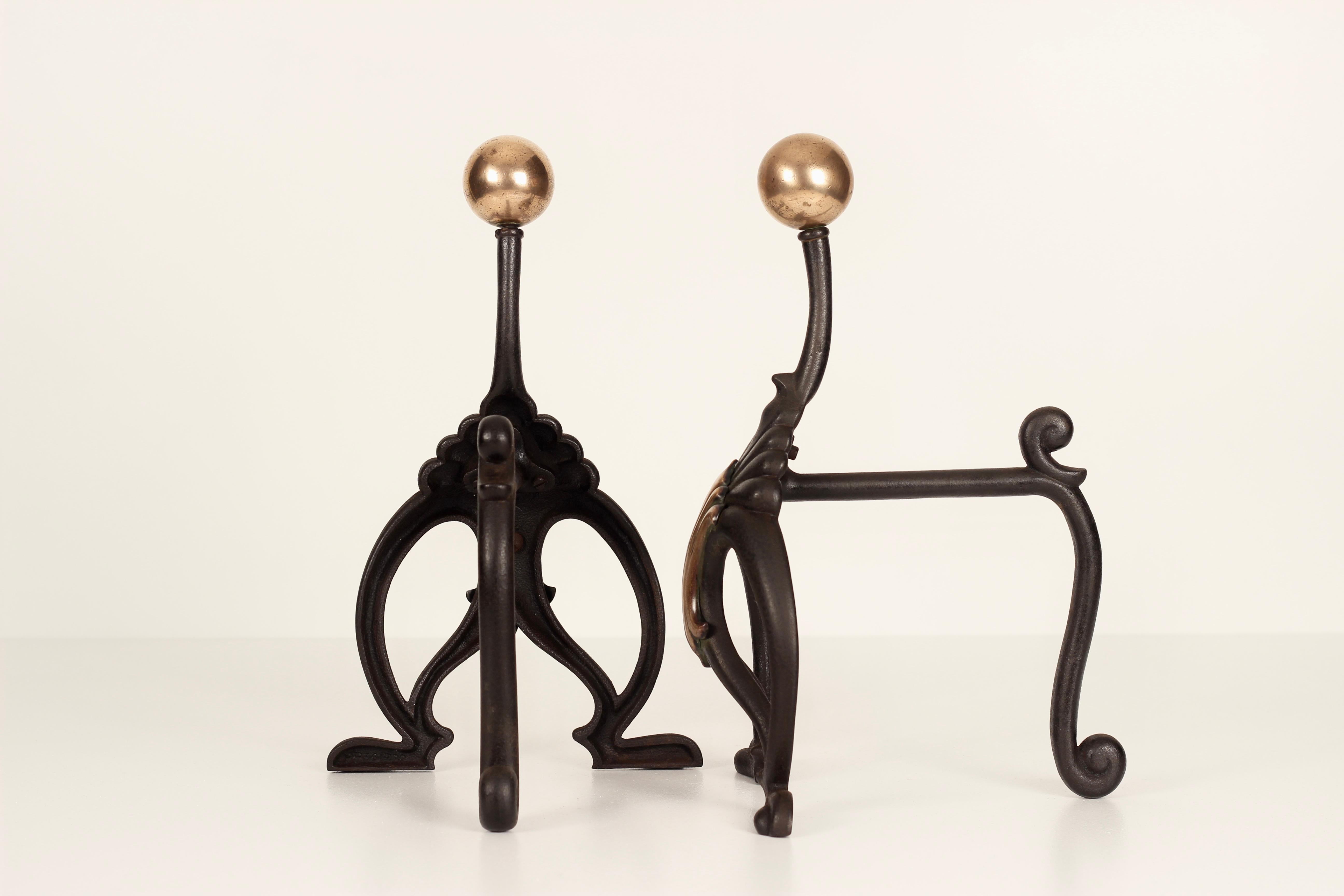 Iron A Pair of Aesthetic Fire Dogs by the English Maker William Tonks & Sons, 1900’s