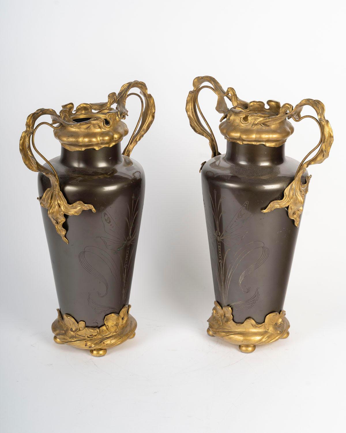 A pair of Art Nouveau gilt bronze and patinated vases, circa 1900, the inside of a planter is missing.

H: 43cm, W: 32cm, D: 18cm

Please contact us before ordering to confirm availability.