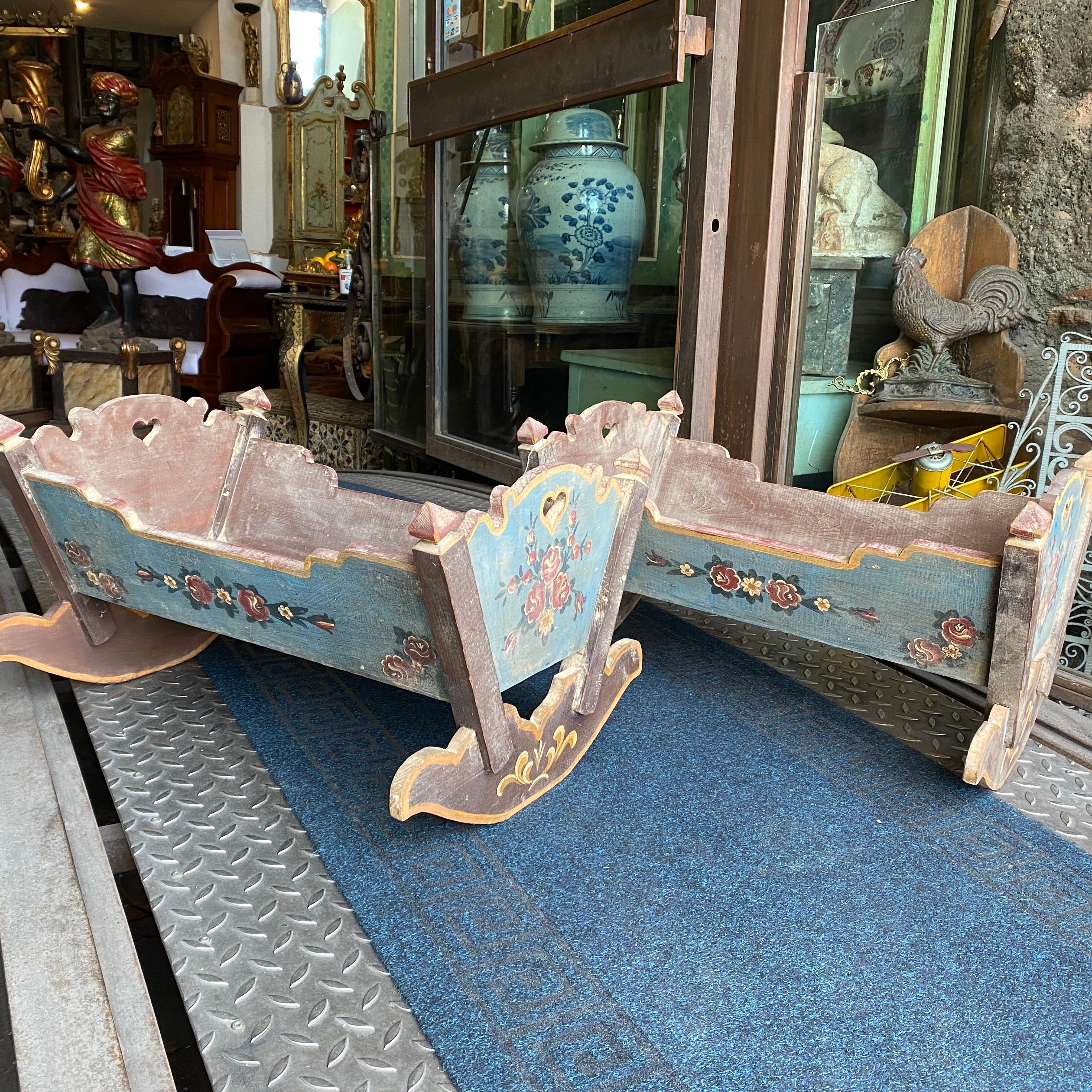 Two toy cots made in Sicily in the early 19th century, they can be used as planters. They are hand-painted with floral decoration.