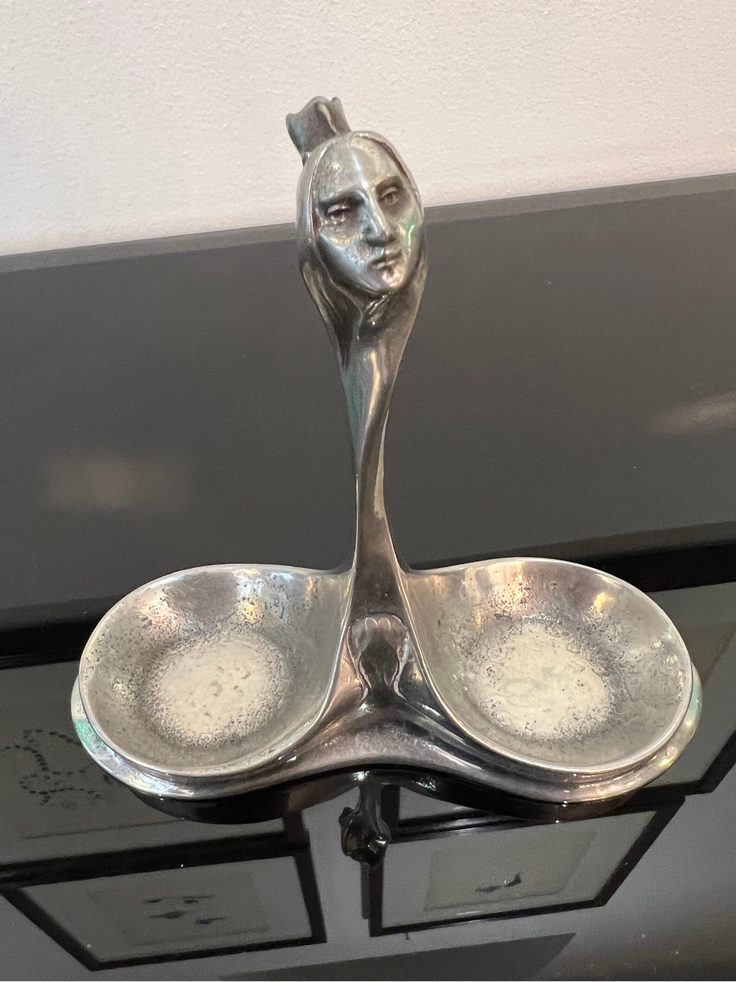 A rare pair of Kayserzinn pewter salters designed by Hugo Leven in Cologne Germany c.1910 
Stamped Kayserzinn no. 4389 

Dimensions: D:5cm W:14cm H:12.5cm.
