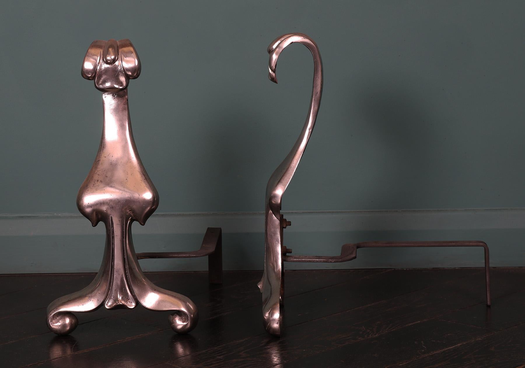 English A Pair of Art Nouveau Polished Steel Fire Dogs For Sale