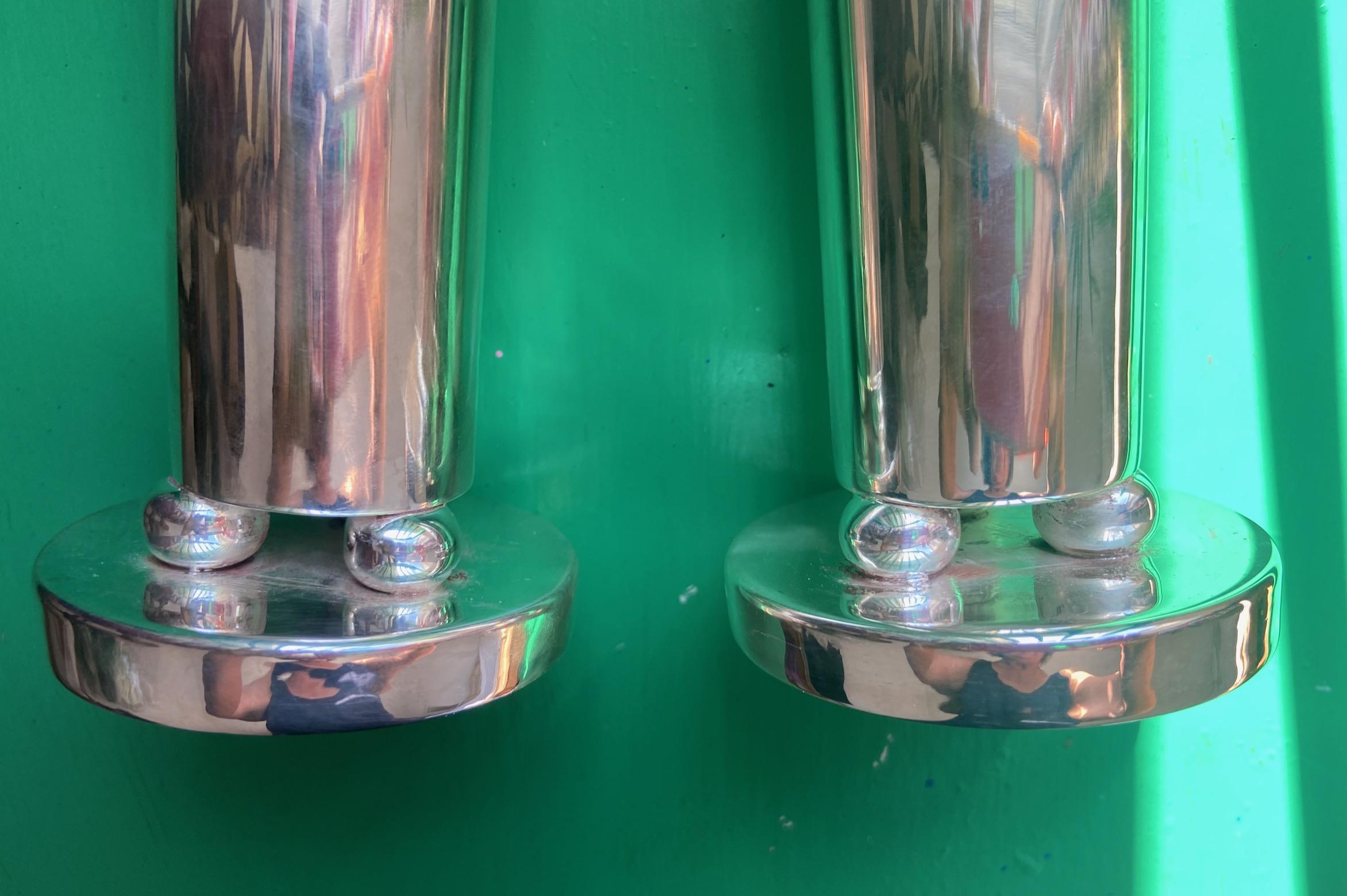 A pair of silver plated Soliflore vases / candle holders of unusual geometric balls design, by Arthur Krupp, Milano, and most probably designed by Gio Ponti. 
Provenance: The Vienna Touring Hotel where most silverware / tableware was designed by Gio