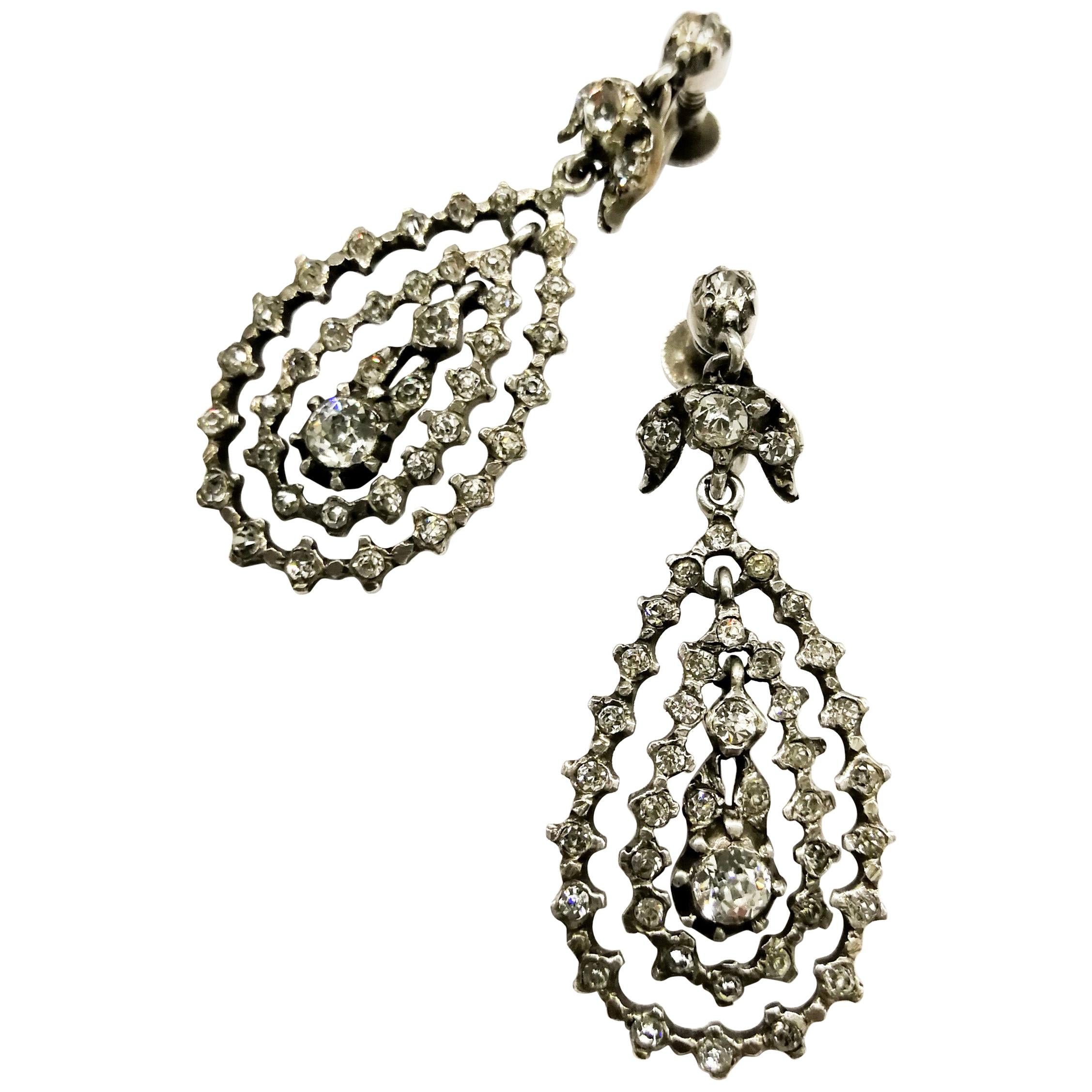 A pair of articulated multi hoop silver and paste drop earrings, French, c1900s