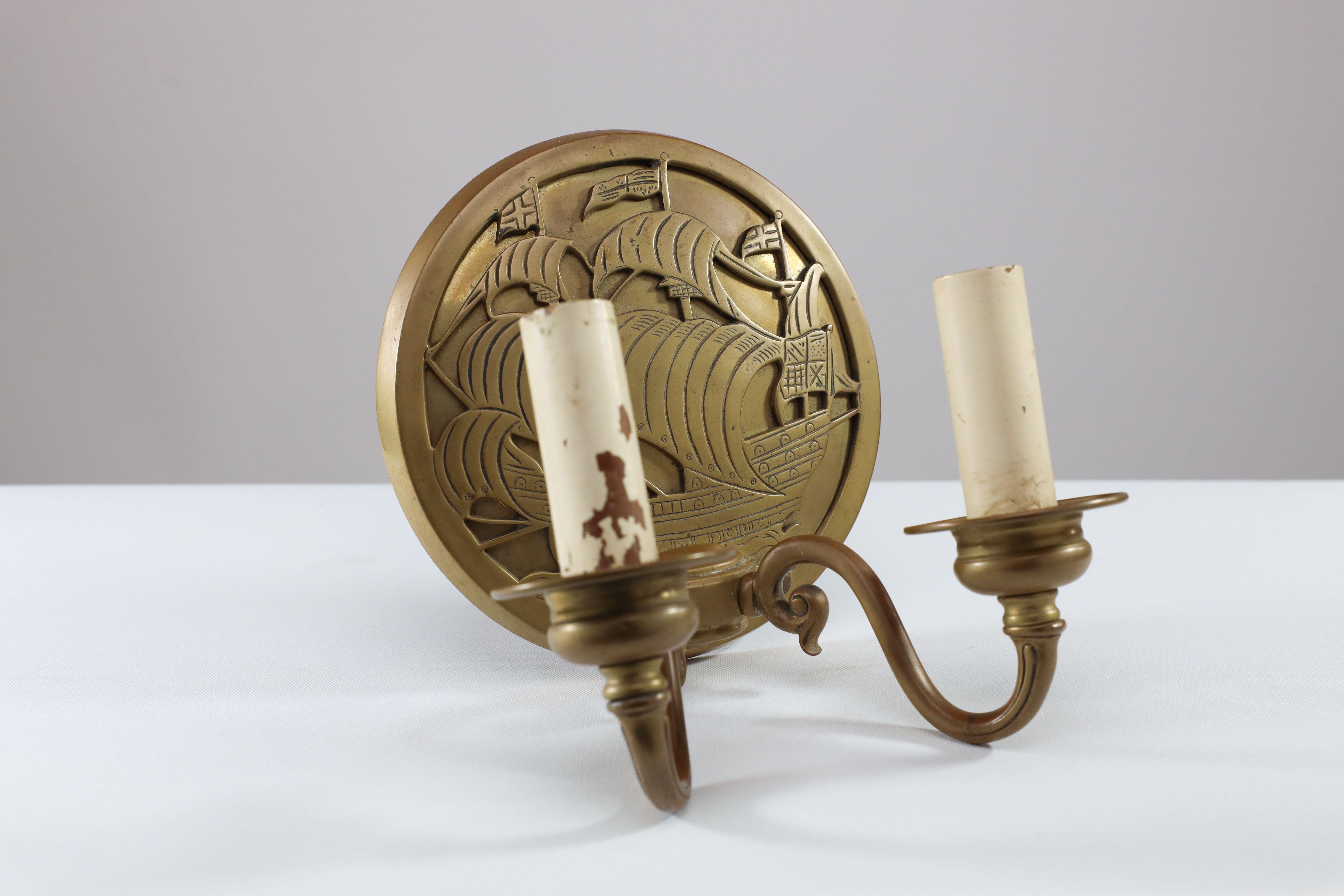 Early 20th Century A pair of Arts and Crafts brass wall lights with Galleons in sail. For Sale