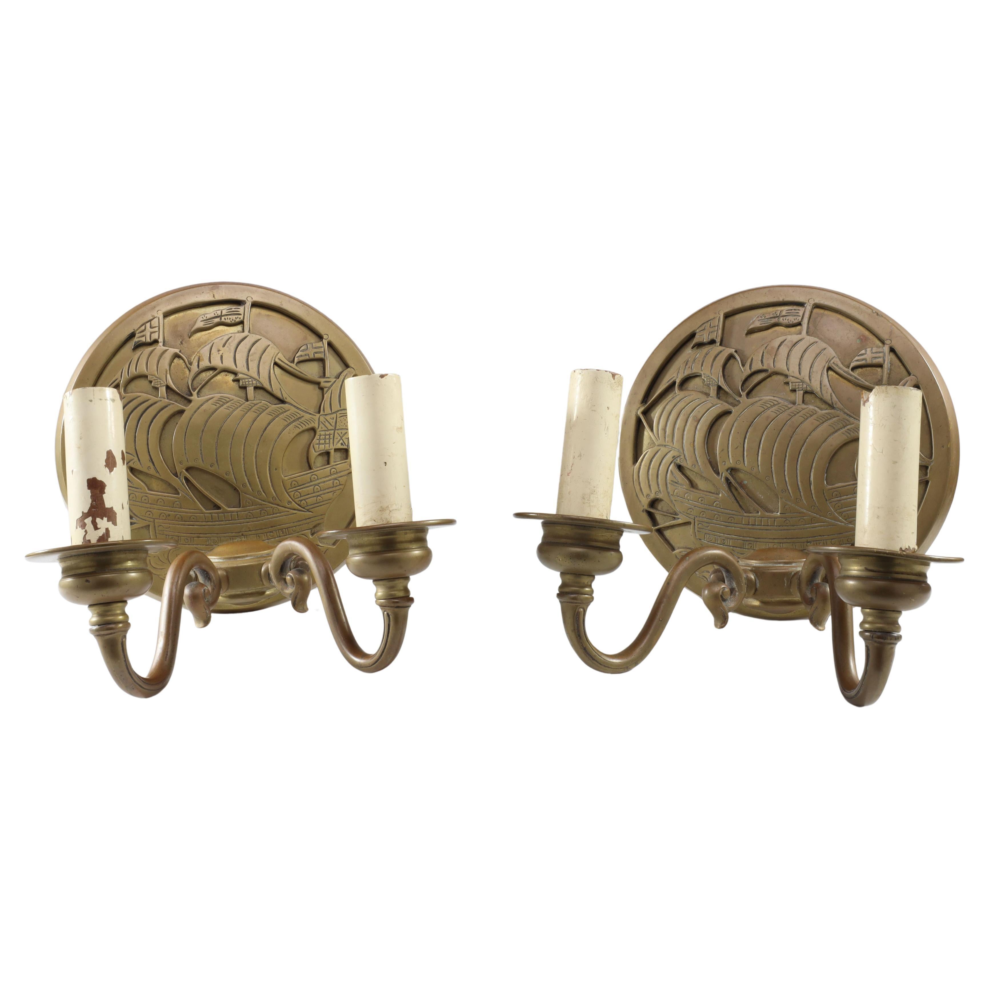 A pair of Arts and Crafts brass wall lights with Galleons in sail. For Sale