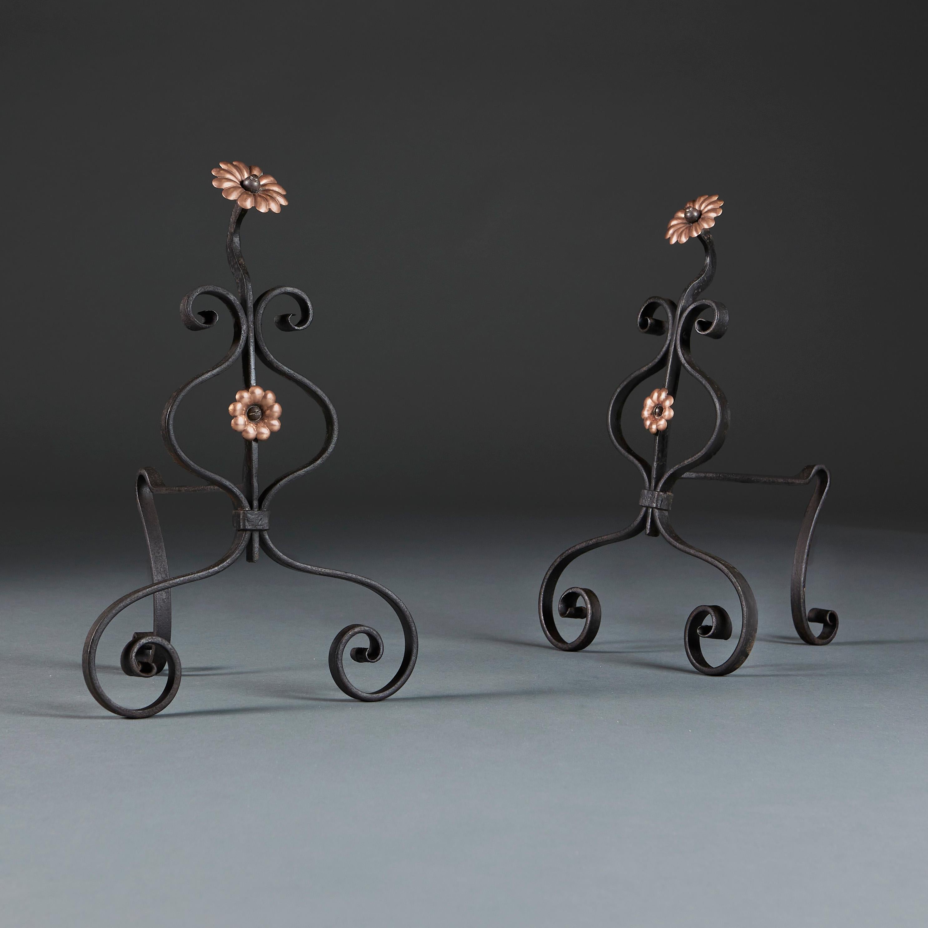 England, circa 1910

A pair of early twentieth century arts and crafts firedogs in the manner of M.H. Bailie Scott with a scrolling wrought iron structure, decorated with moulded copper flowers.

Height 37.00cm
Width 24.00cm
Depth 21.00cm.