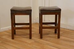 Pair of Arts and Crafts Golden Oak and Leather Stools