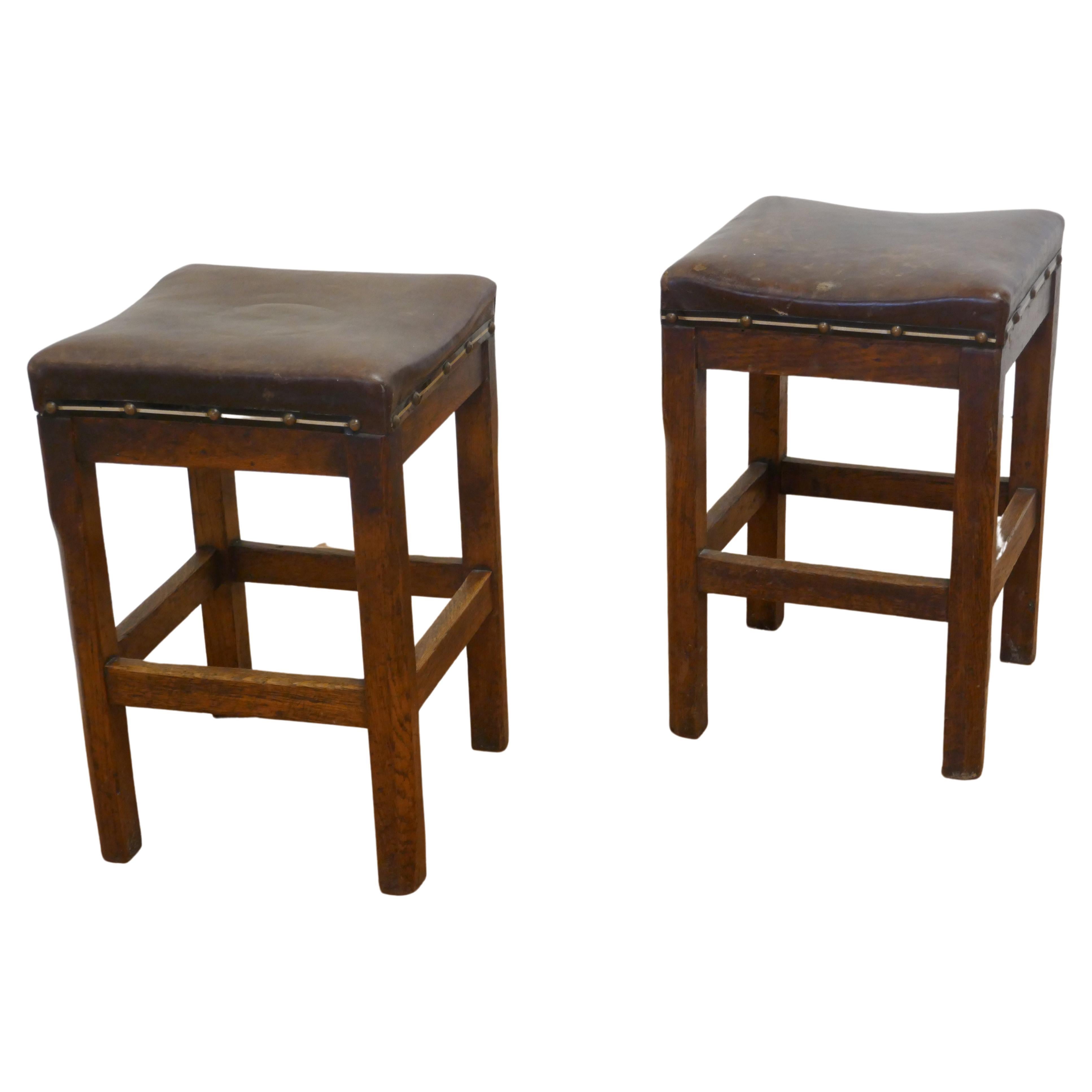 Pair of Arts and Crafts Golden Oak and Leather Stools For Sale