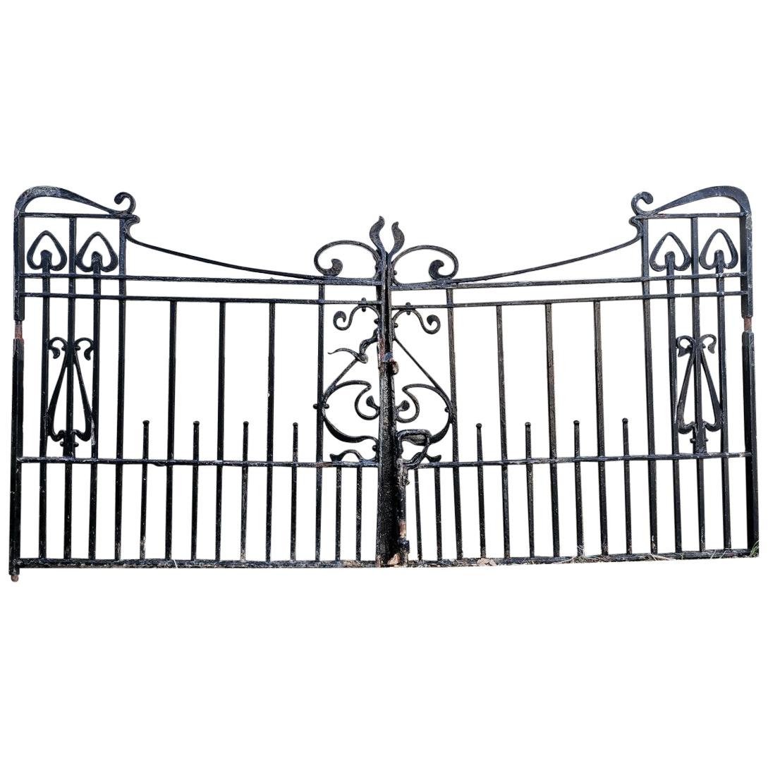 Pair of Arts & Crafts Hand Forged Iron Gates with Sweeping Top Rails