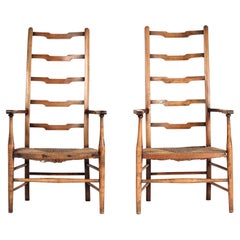 A pair of Arts and crafts ladder back chairs early 1900’s England