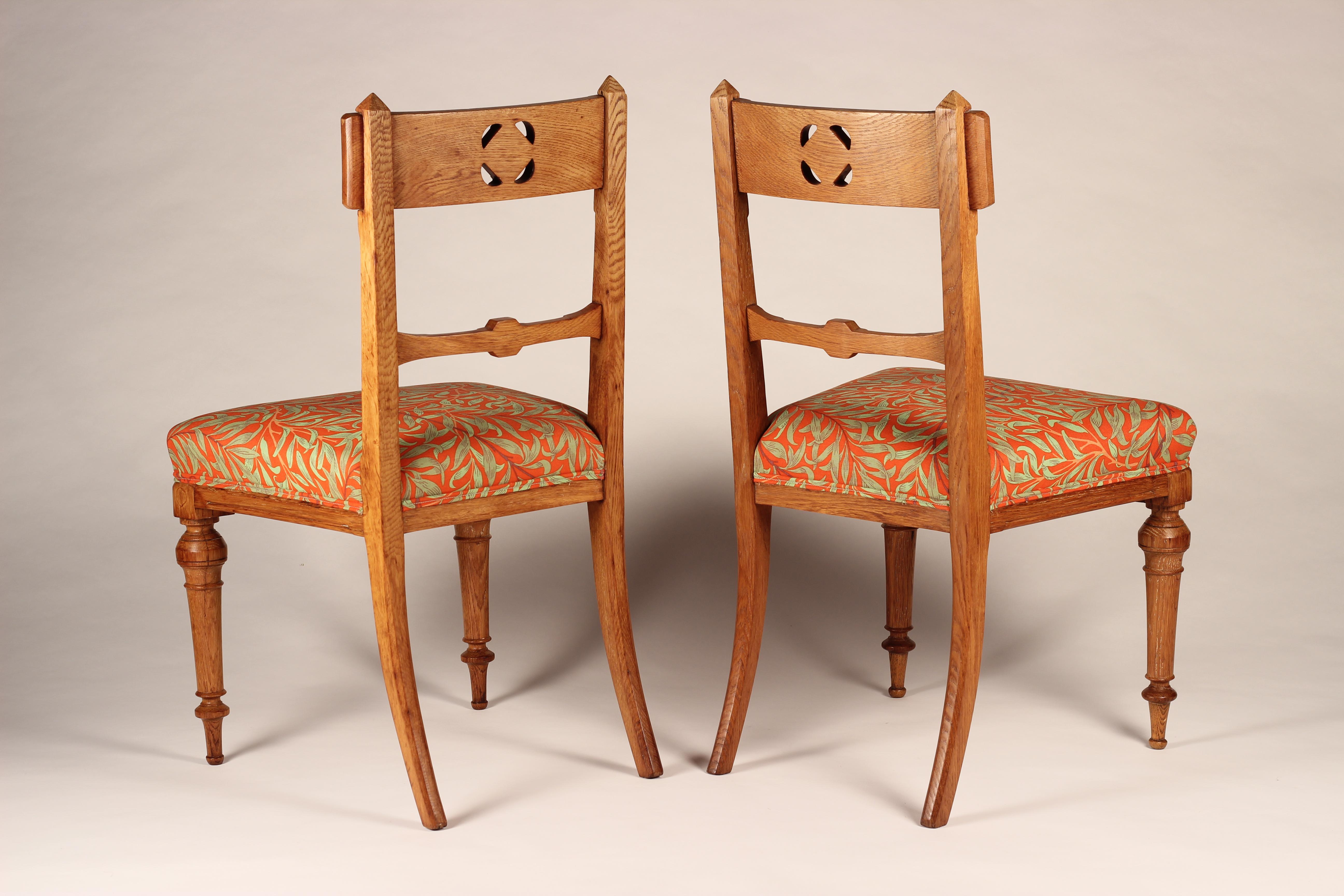 Carved Pair of Arts & Crafts Oak Back Pierced Hall Chairs with fabric by Morris & Co For Sale