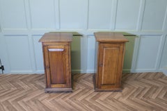 A Pair of Arts and Crafts Oak Bedside Cupboards