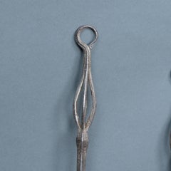 A pair of Arts and Crafts steel fire utensils