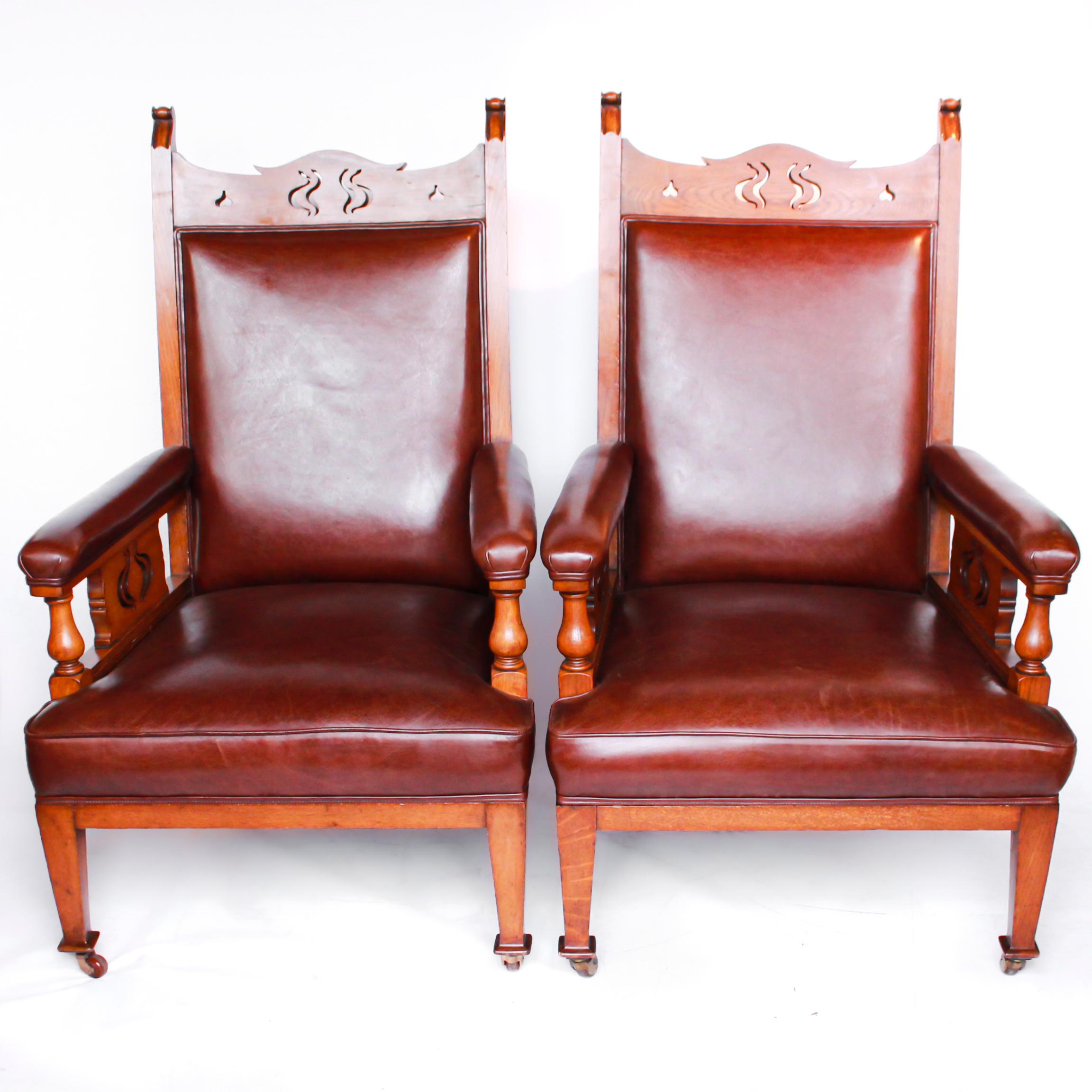 A pair of Arts & Crafts library chairs attributed to Liberty & Co. Solid oak frame. Carved detail to top and sides. Upholstered in Chestnut leather. 

Dimensions: H 103cm, W 56cm, seat D 66cm

Origin: English

Date: circa 1910

Item no:
