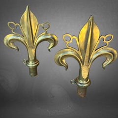A Pair Of Arts & Crafts Polished Bronze Fleur De Lys Pole Ends Or Finials
