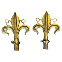 A Pair Of Arts & Crafts Polished Bronze Fleur De Lys Pole Ends Or Finials