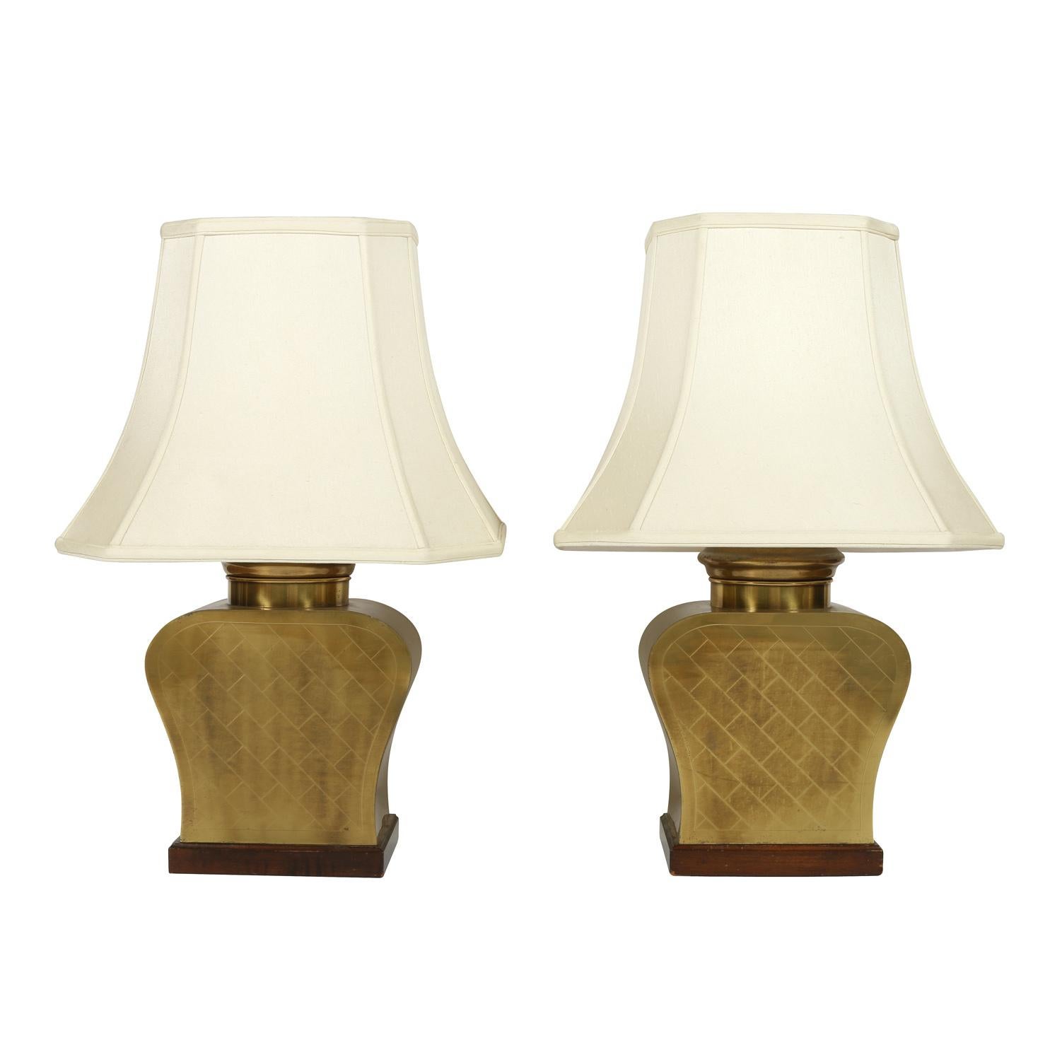 A pair of Asian vintage brass, urn form lamps with etched detail.