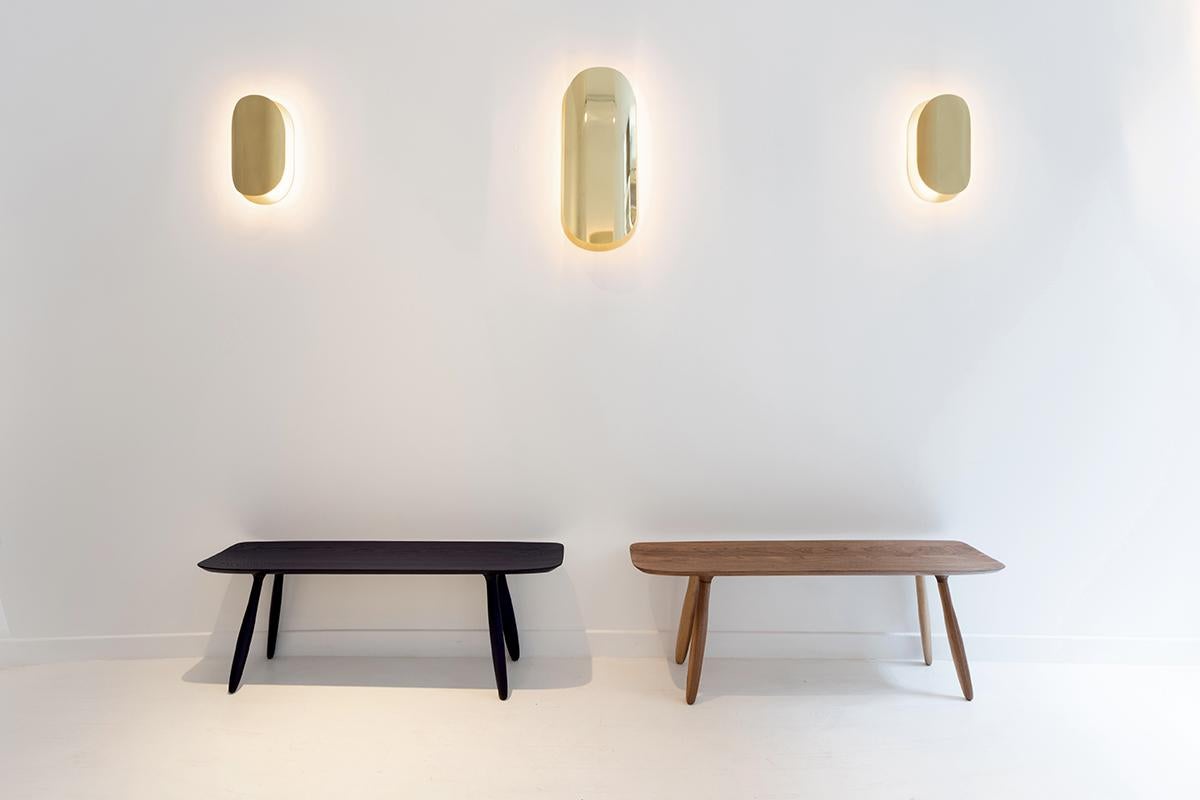 The Astra Wall-light is thought of as a sculpture. It recalls the mesmerizing effect of a lunar eclipse, playing around simple shapes to capture interesting lighting effects. 
Obtained by chimical reactions, these patinas with rare shades and