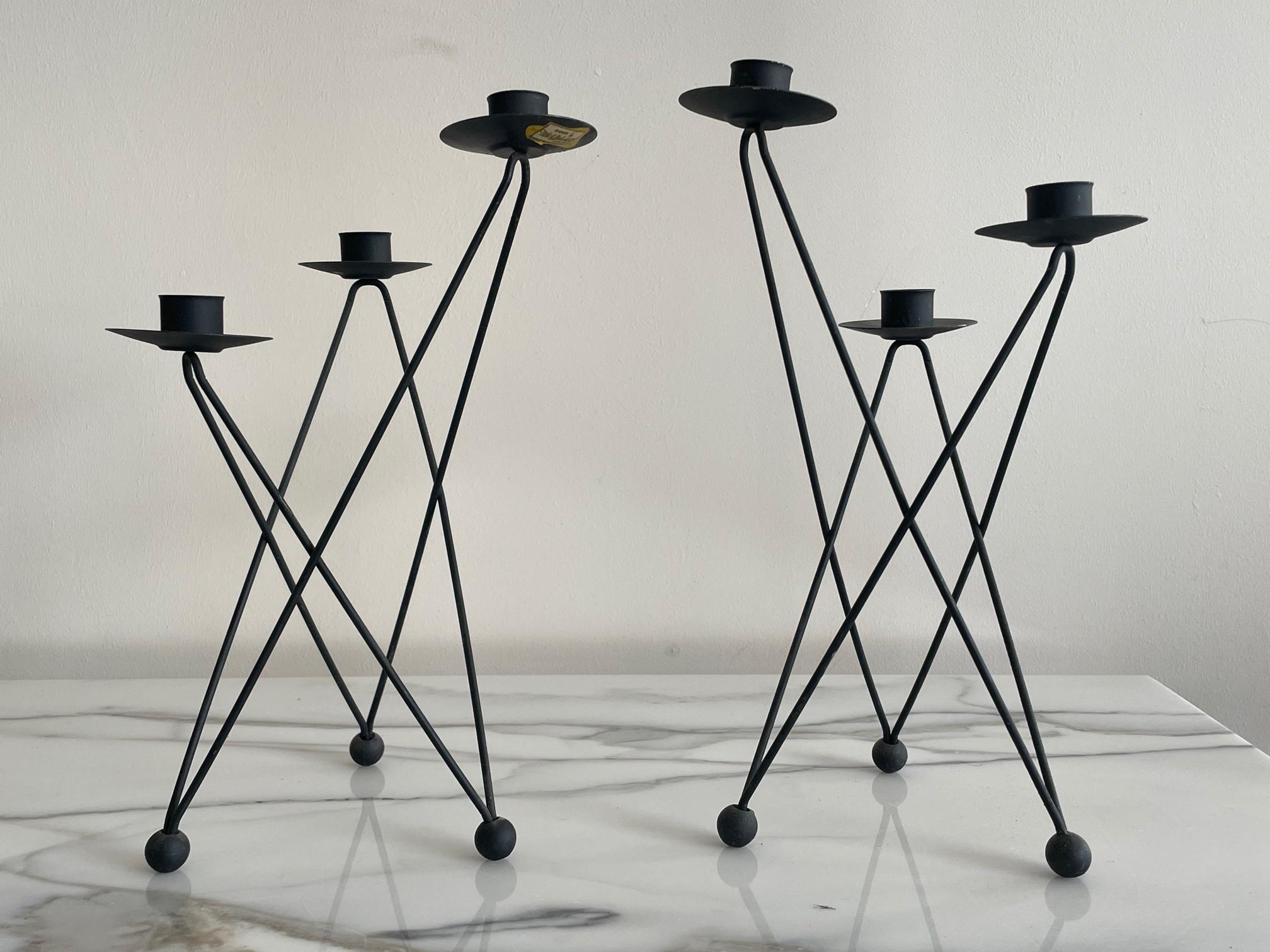 A pair of Atomic 1950's candleholders by Victor H.Bisharat, a Jordanian born architect, active in California in the 1950's. One retains original label.