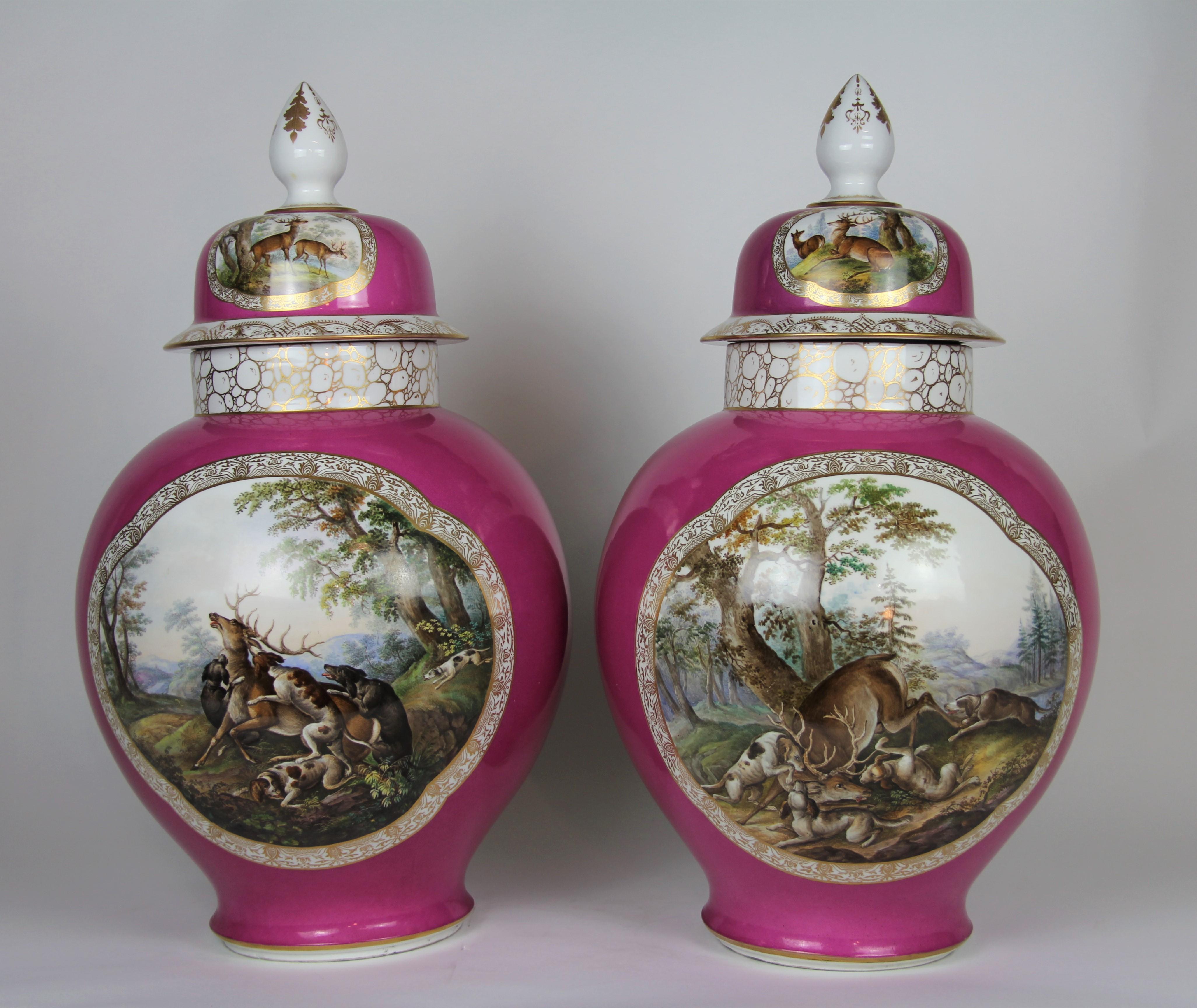 A monumental pair of 19th century Louis XVI style Augustus Rex Meissen Porcelain pink ground hunting scene covered vases. Each is beautifully hand painted with scenes of hunters, hunting dogs, deers, and trees. They are both painted with meticulous