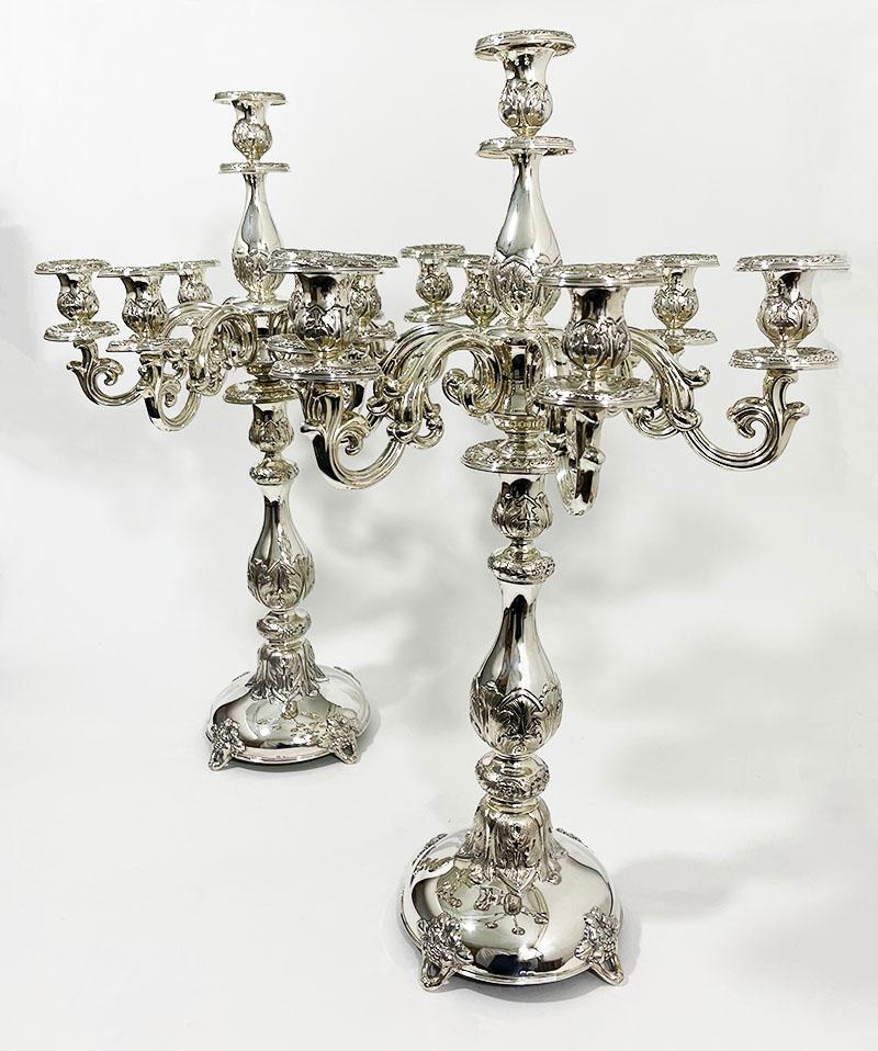 A pair of Austro-Hungarian Empire 66 cm high silver candelabras, 19th century.

Beautifully decorated with grape leaf pattern with grapes on a raised smooth round base.
The candelabra consists of 7 arms in rocaille style. 
The candelabras have a