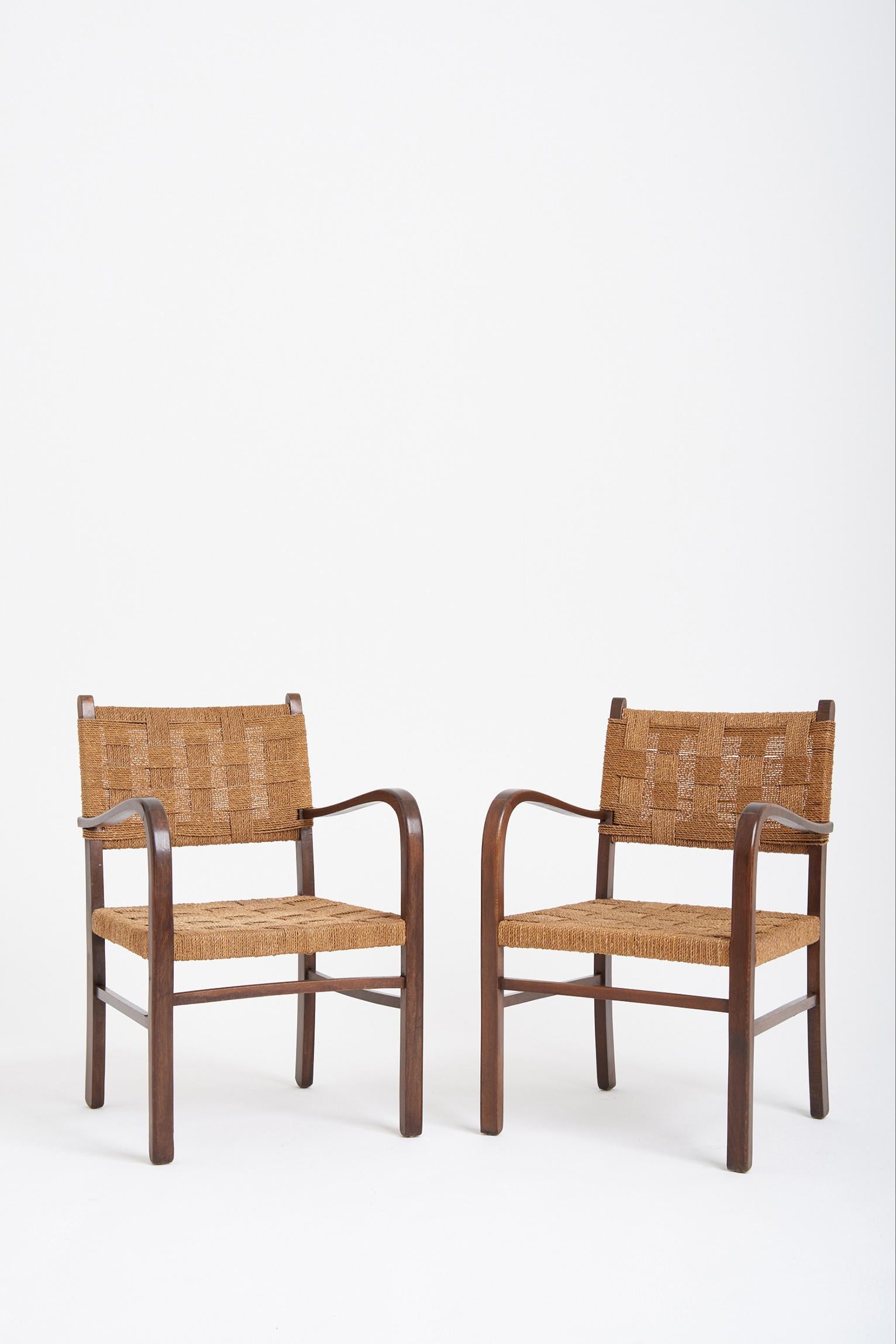 A pair of Bahaus beech wood and woven seagrass rope armchairs, by Erich Dieckmann (1896-1944),
circa 1925-1930.
 
Erich Dieckmann was one of the most important Bauhaus furniture designers. From 1918 until 1920 Erich Dieckmann studied architecture