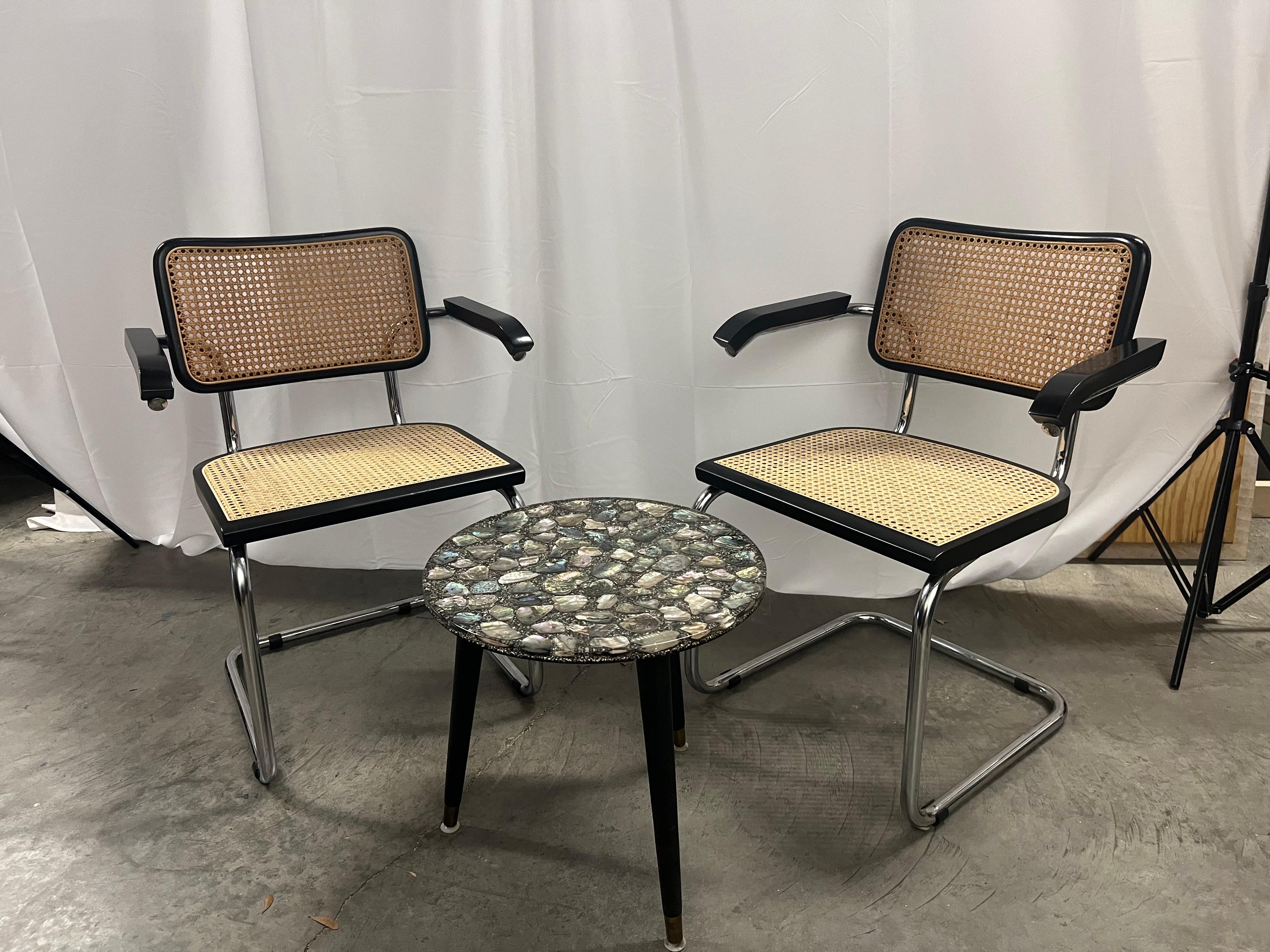 Italian deep brown & chrome Marcel Breuer cesca chair with arms,cane seat and back.  Please take note of the honey colored seat with the deep brown back.   I personally love the contrast and all the caning is original.  Please see our other listings
