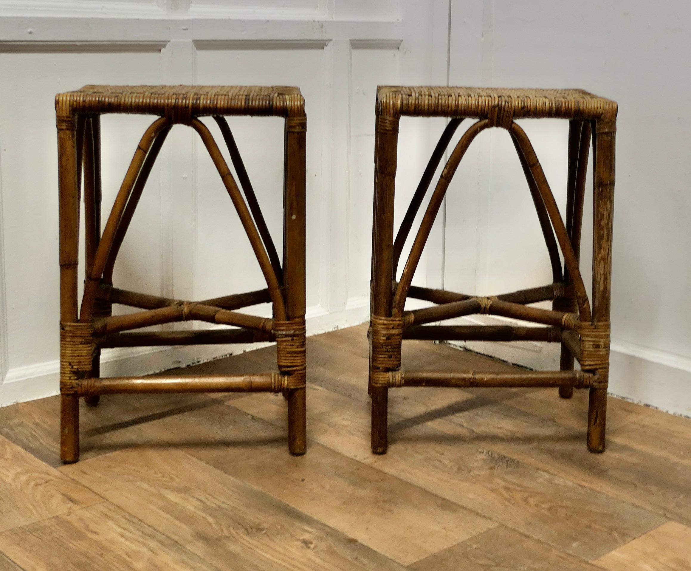 A Pair of Bamboo High Stools/Tables or Window Seats

A Very attractive pair with a beautiful mature colour, the seats are beautifully woven
These stools would make good window seats, bar stools or occasional tables and they are in good condition