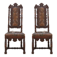 A Pair of Baroque Side Chairs with original leather