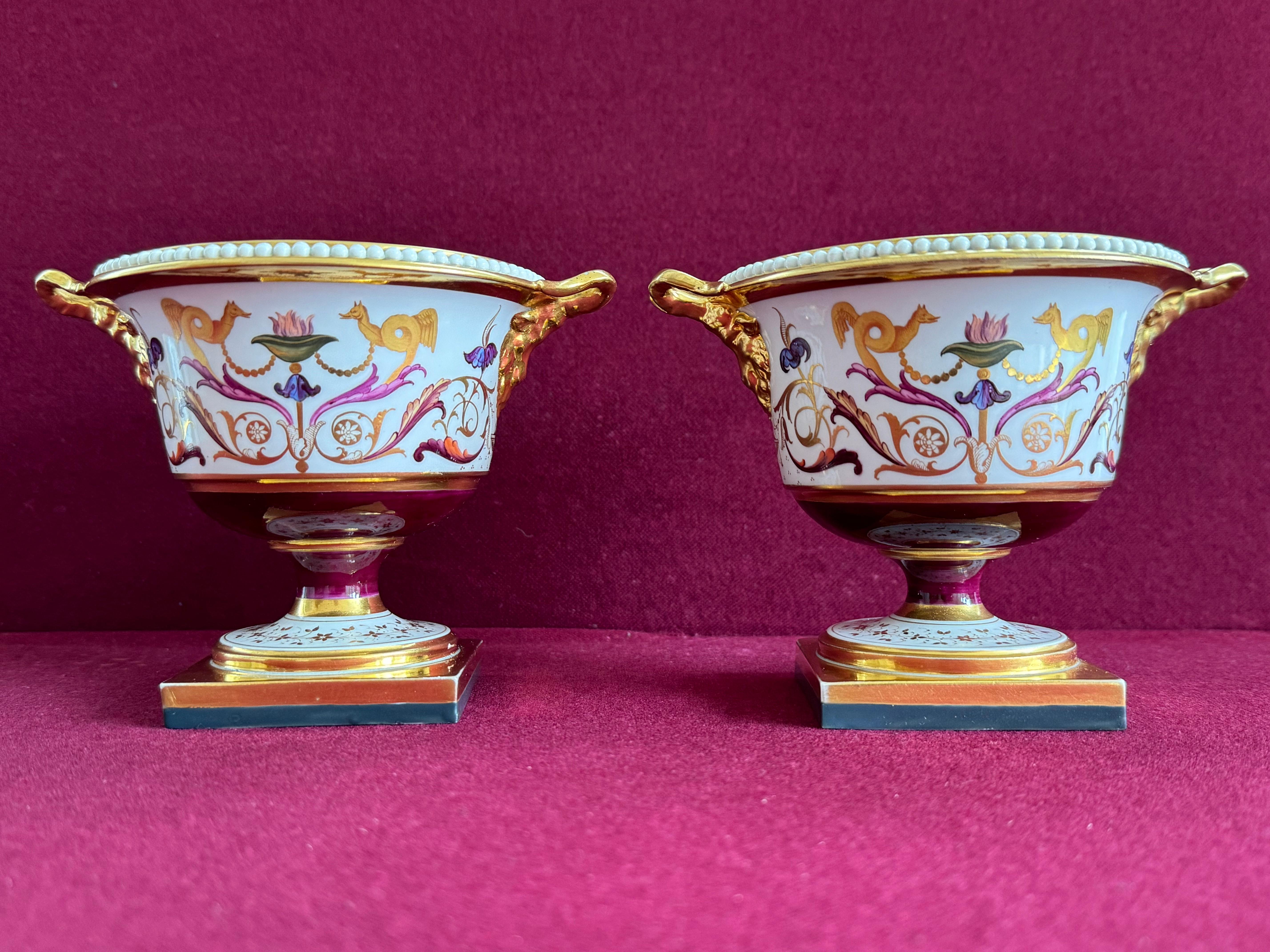 A nice pair of Barr, Flight and Barr Worcester Porcelain Pastille Burners c.1810-1813. Each pastille burner of classical urn shape on square base, with finely modelled 'pearls' to the rim, with two ram's head handles solidly gilded, the main body of