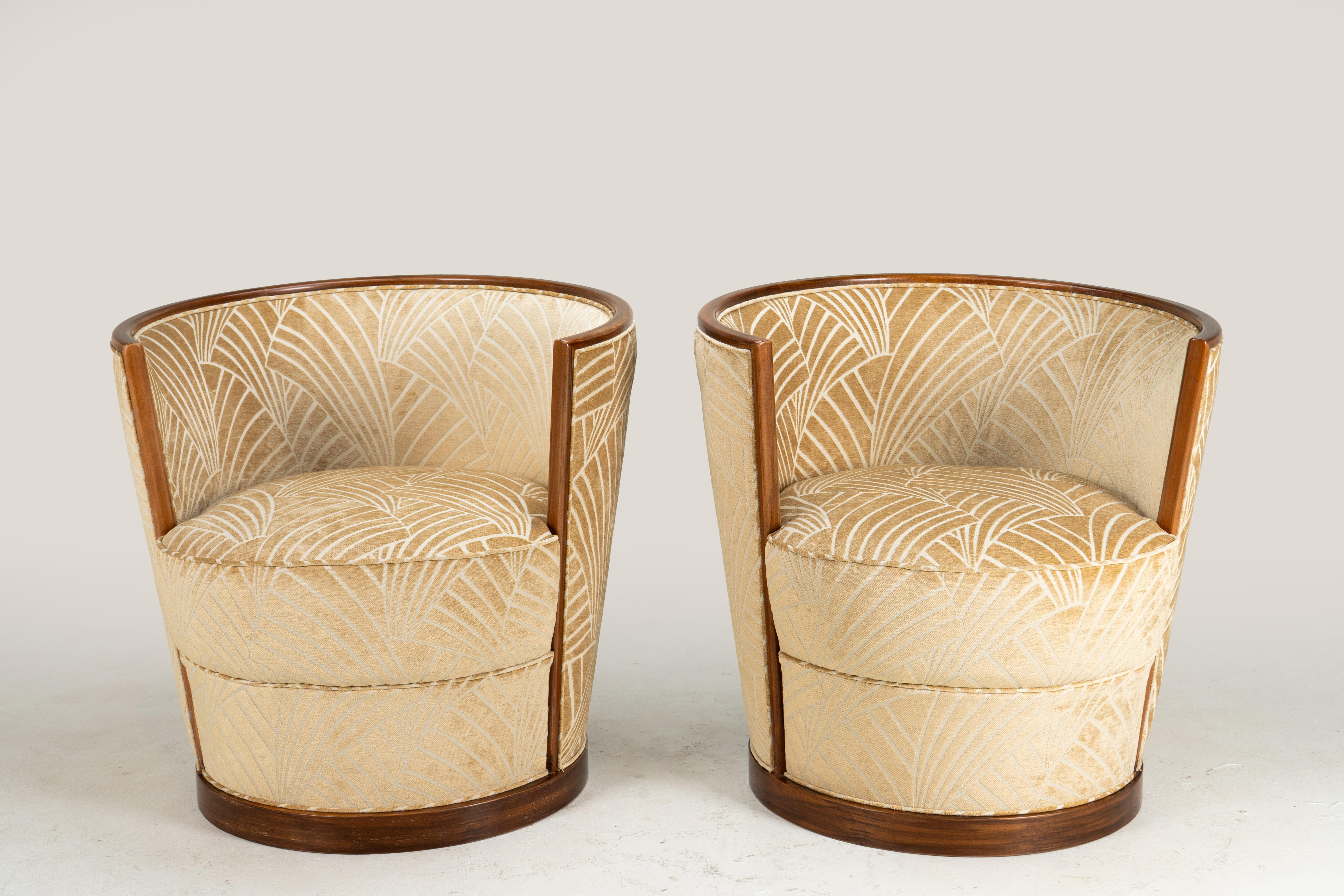 These stylish armchairs are based on a classic French Art Deco design. Hungarian furniture makers thrived through the interwar period, perfecting streamlined Art Deco designs, which mostly originated in France. However, Hungarians tended to simplify