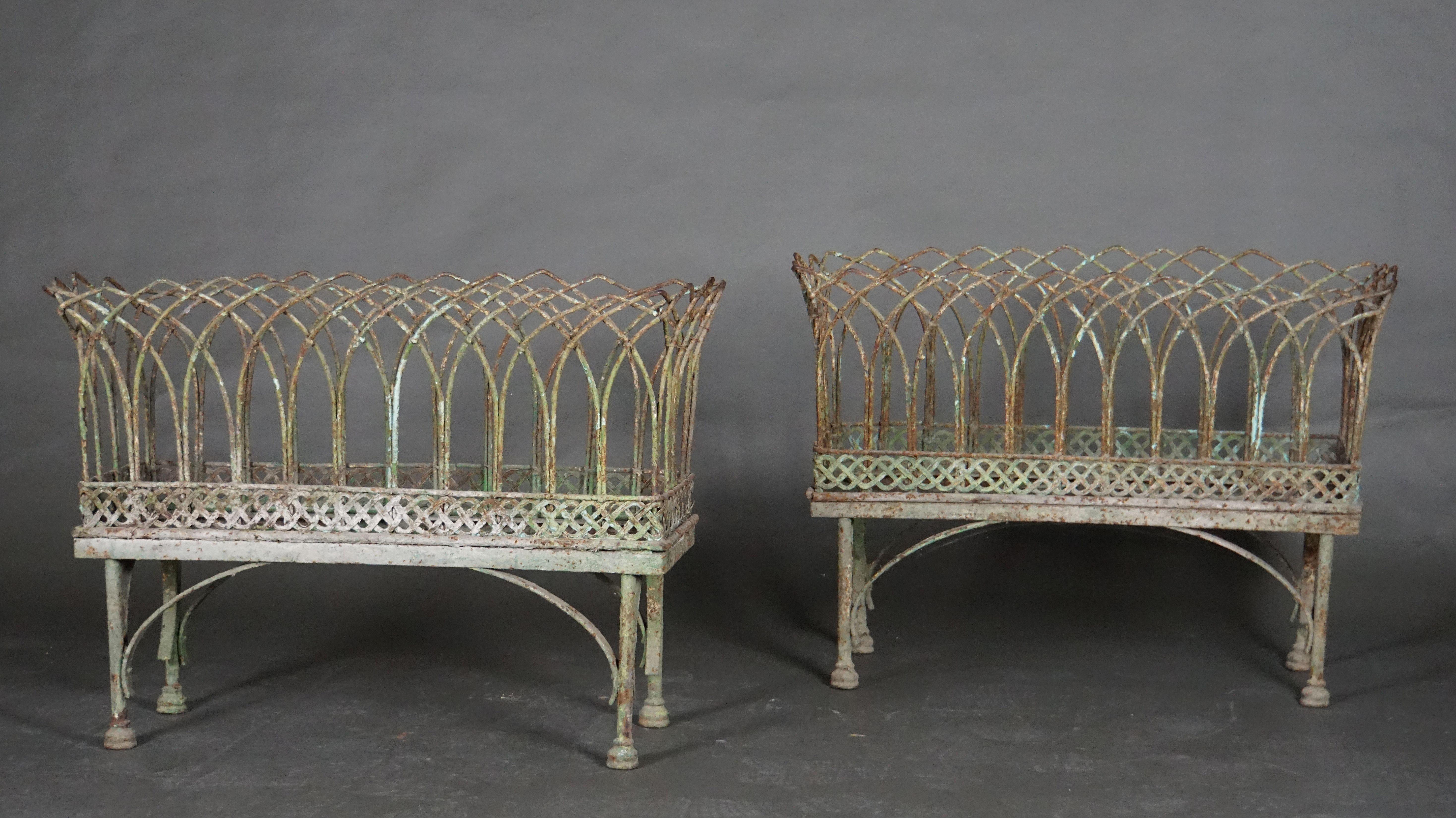 Pair of iron basket-style jardinières with old painting, France, 19th century.
Beautiful patina.
 