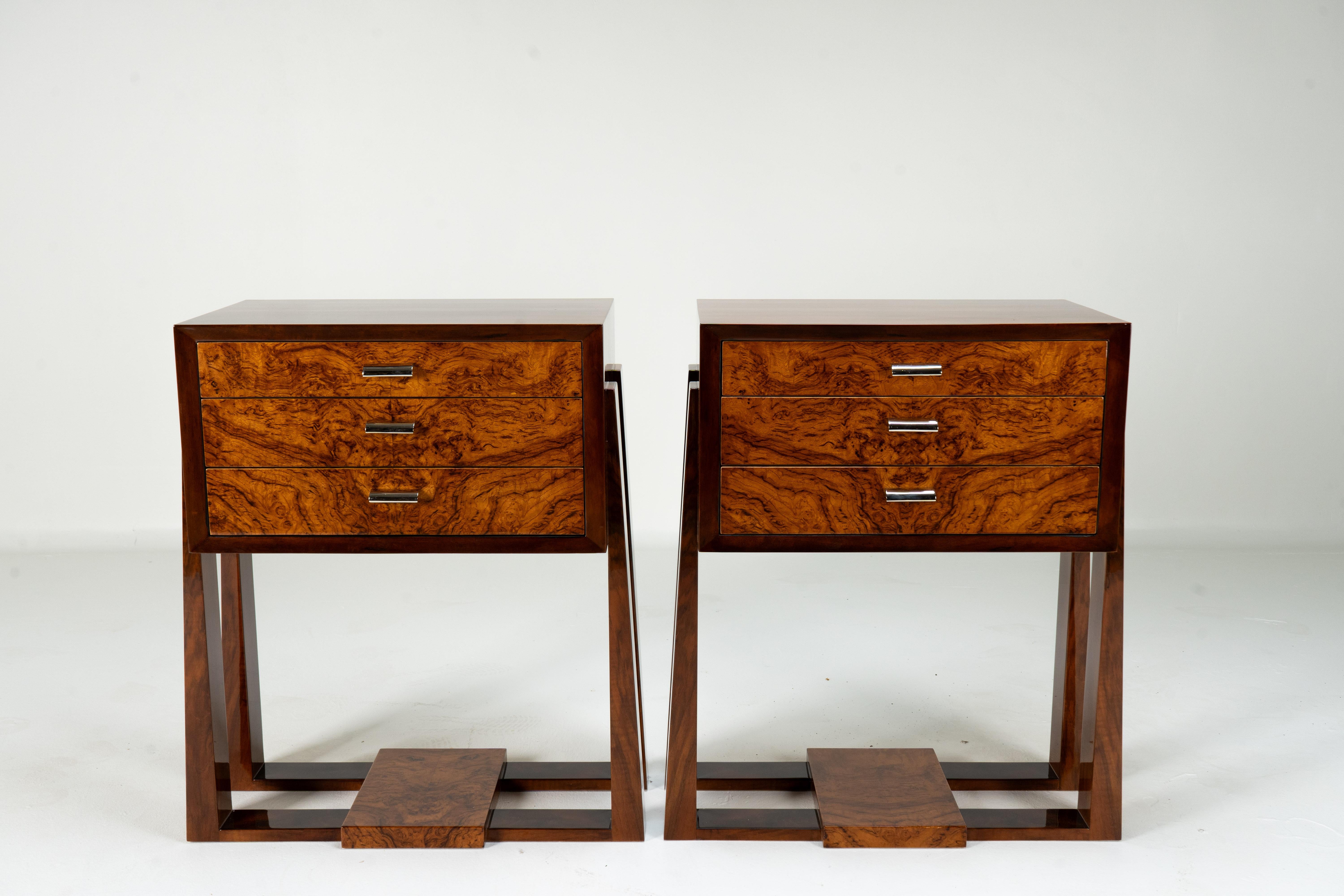 These glossy and sophisticated side chests exemplify Hungarian Art Deco design. Inspired equally by French Art Deco and Bauhaus design, these chests utilize local materials and industrial manufacturing techniques. The legs are solid walnut wood, and