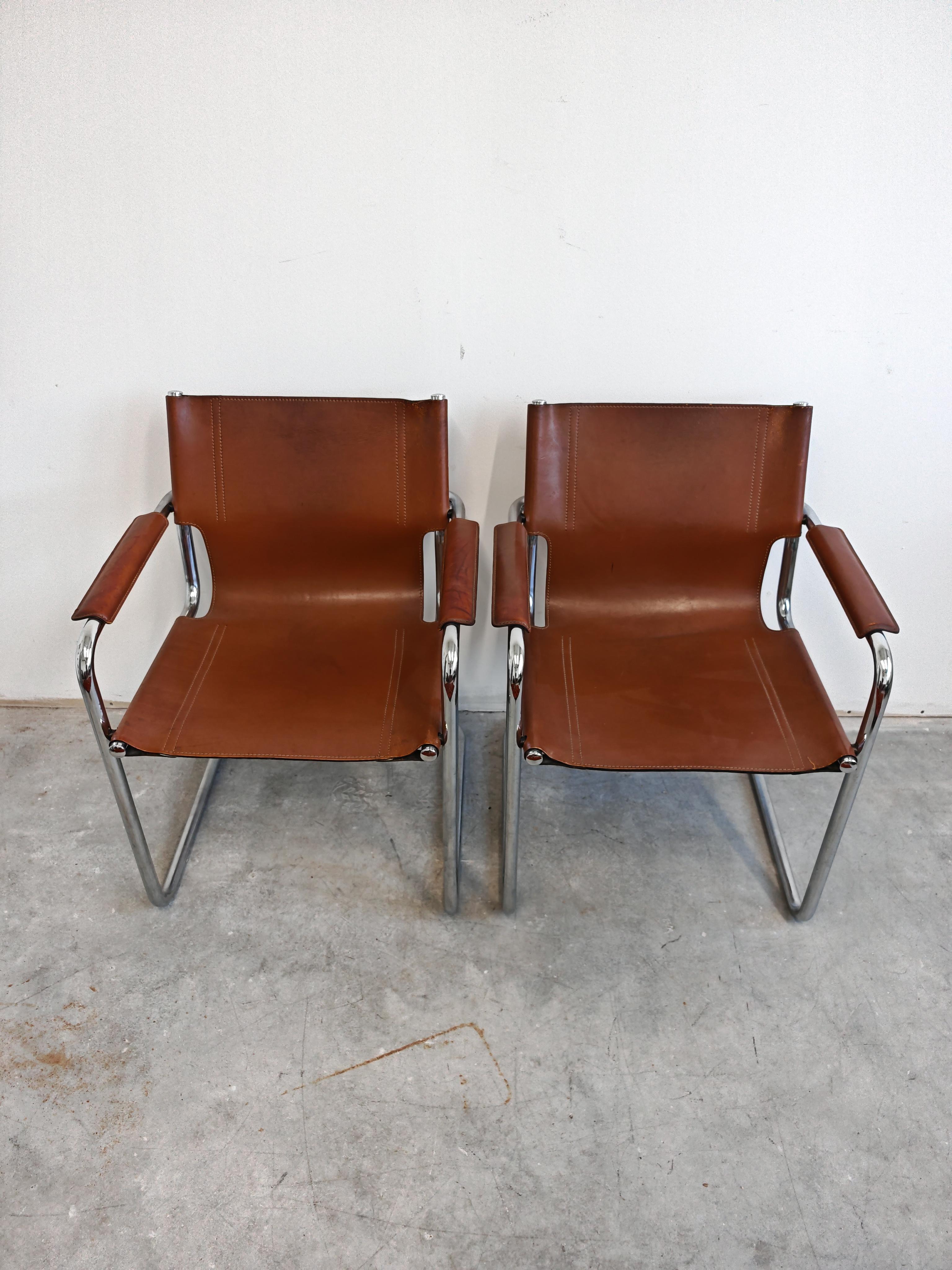 In this listing you will find the iconic Visitor's chairs designed by Mart Stam in 1920s and later manufactured by Matteo Grassi in the 1970s. The chairs feature tubular chrome plated steel frames and brown leather seats. Each chair has Matteo