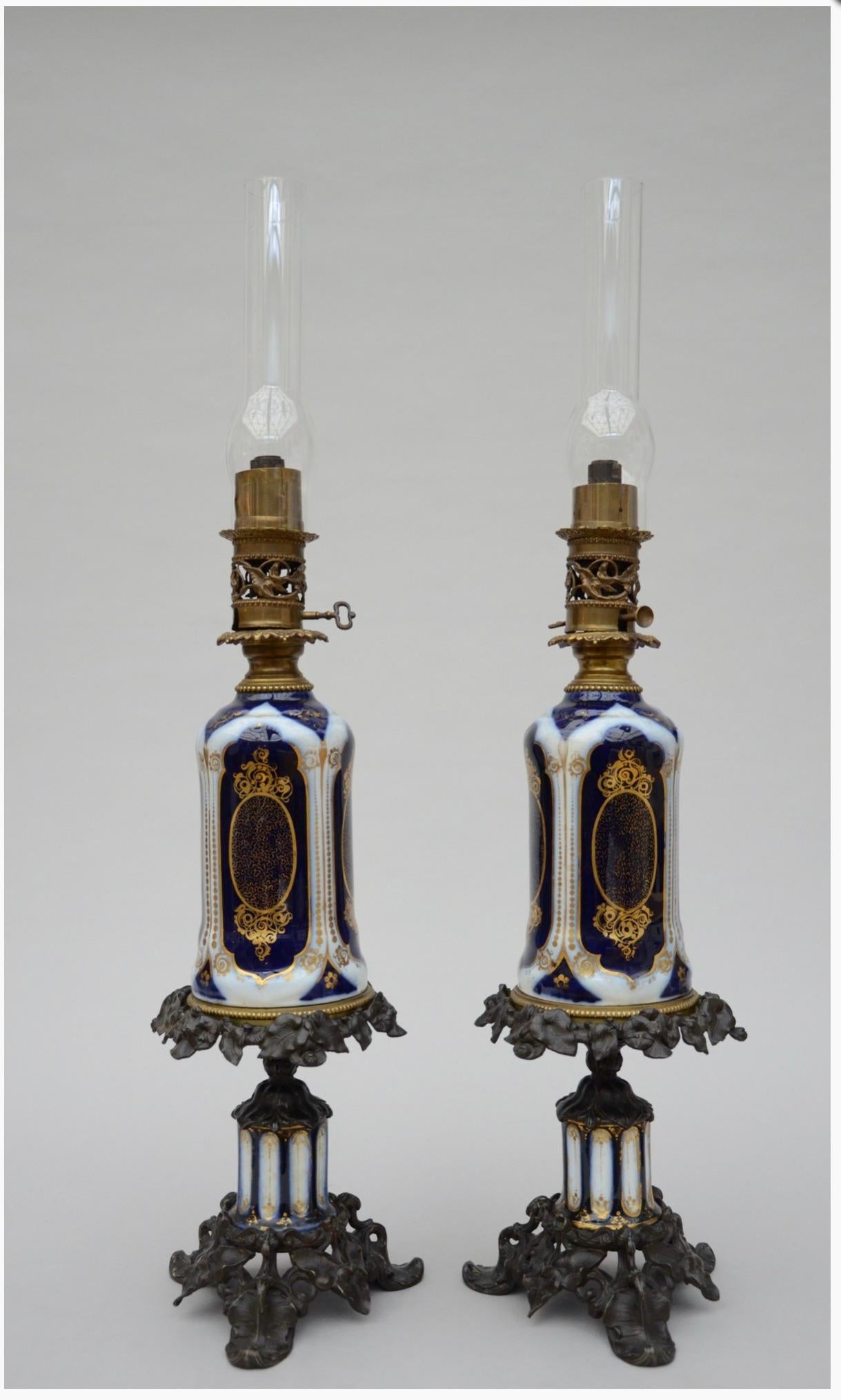A pair of Bayeux oil lamps with bronze mounts.

A pair of antique French oil lamps in hand painted Bayeux porcelain.
Colors used is typical Bayeux porcelain.

Height with glass 33.8