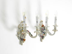 A pair of beautiful hand-painted mid-century porcelain wall lamps