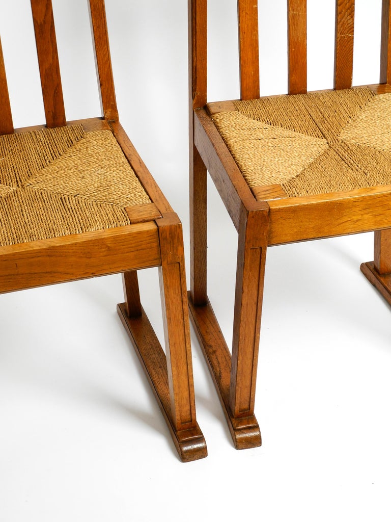 Pair of Beautiful Rare Mid Century Oak Chairs with Skid Feet and Wicker