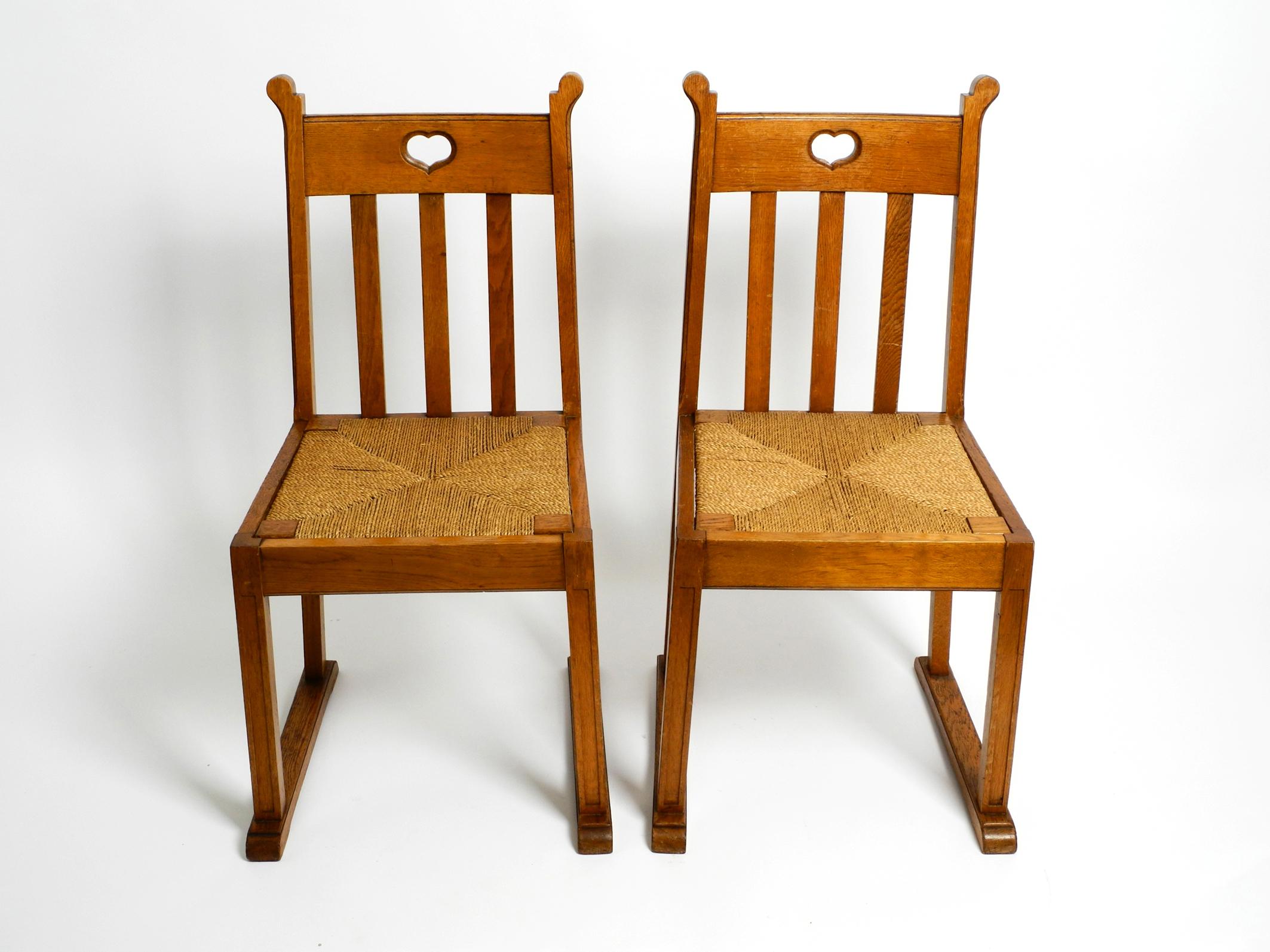 Mid-Century Modern Pair of Beautiful Rare Mid Century Oak Chairs with Skid Feet and Wicker Seats For Sale