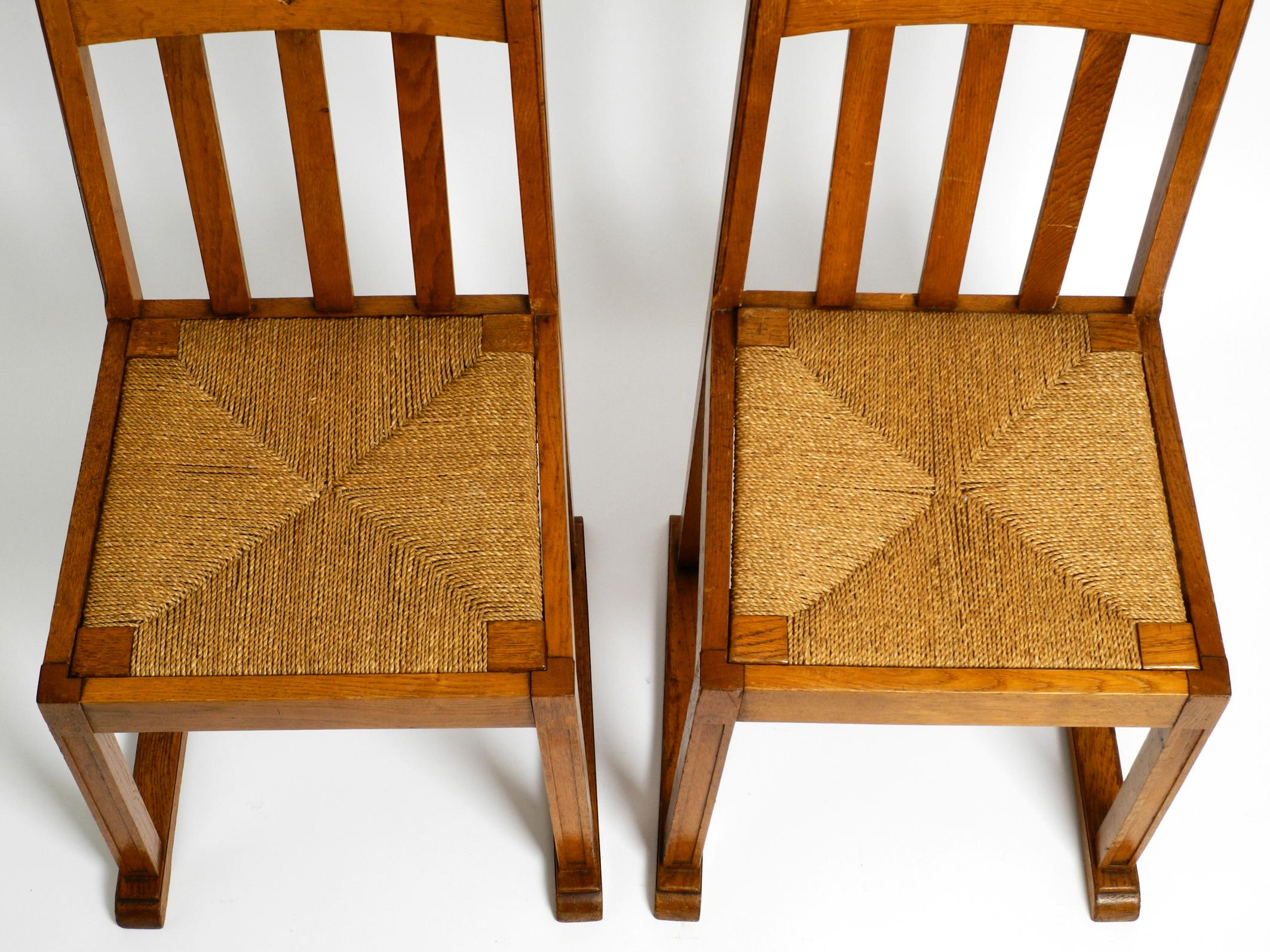 Mid-20th Century Pair of Beautiful Rare Mid Century Oak Chairs with Skid Feet and Wicker Seats For Sale