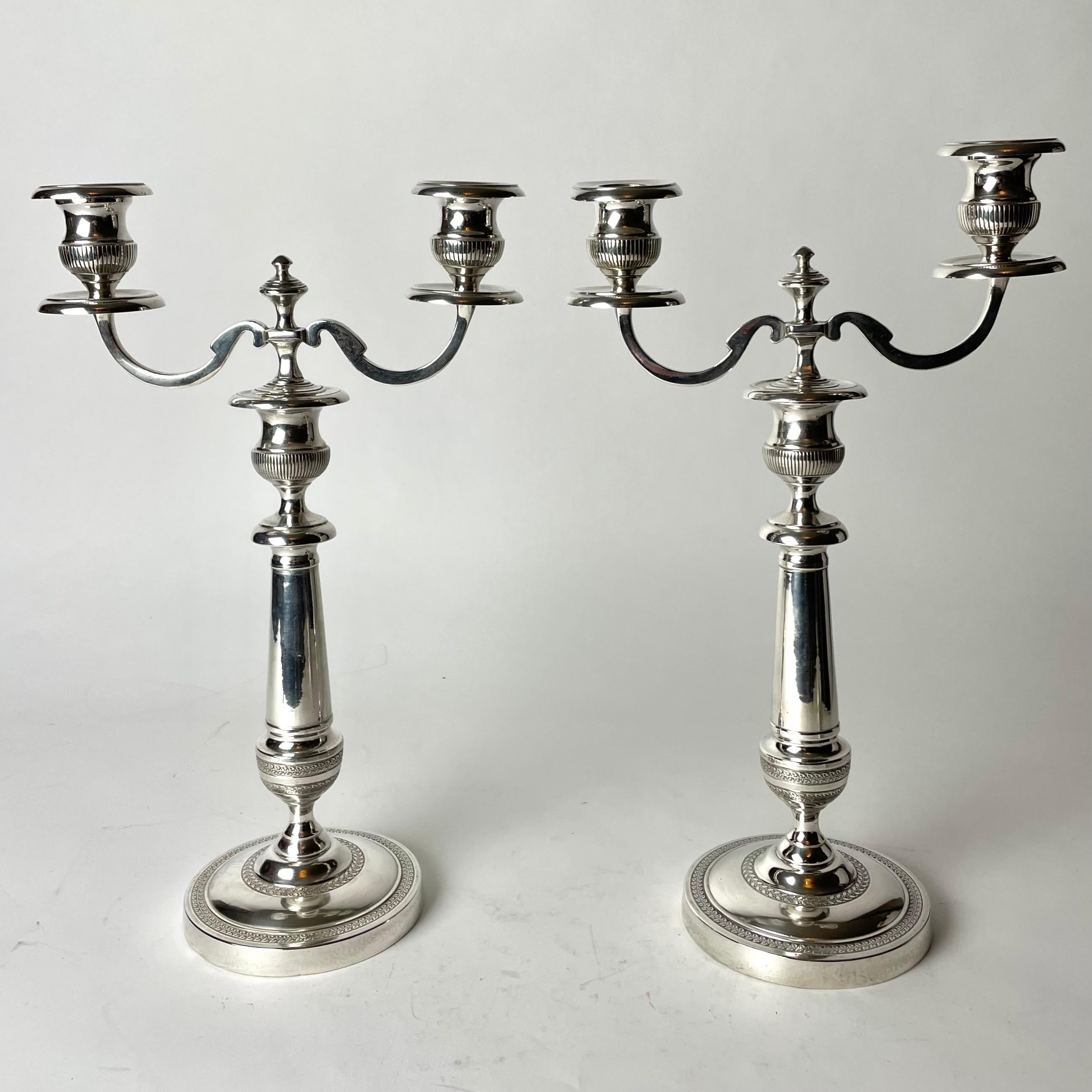 A pair of beautiful silver-plated Candelabras. Swedish Empire (Karl Johan) from the 1820s. Unusual model, can be used both as candelabra and ordinary candlesticks.


Wear consistent with age and use 