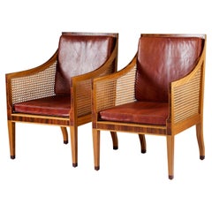 A pair of Bergere Chairs designed By Kaare Klint for Rud Rasmussen A pair of Bergere Chairs designed By Kaare Klint for Rud Rasmussen
