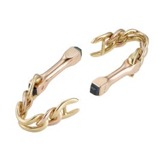 A Pair Of Bi-colour Gold And Sapphire Stirrup Cufflinks