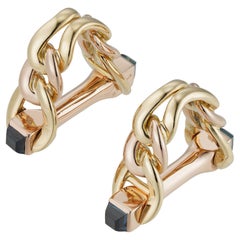 A Pair Of Bi-colour Gold And Sapphire Stirrup Cufflinks