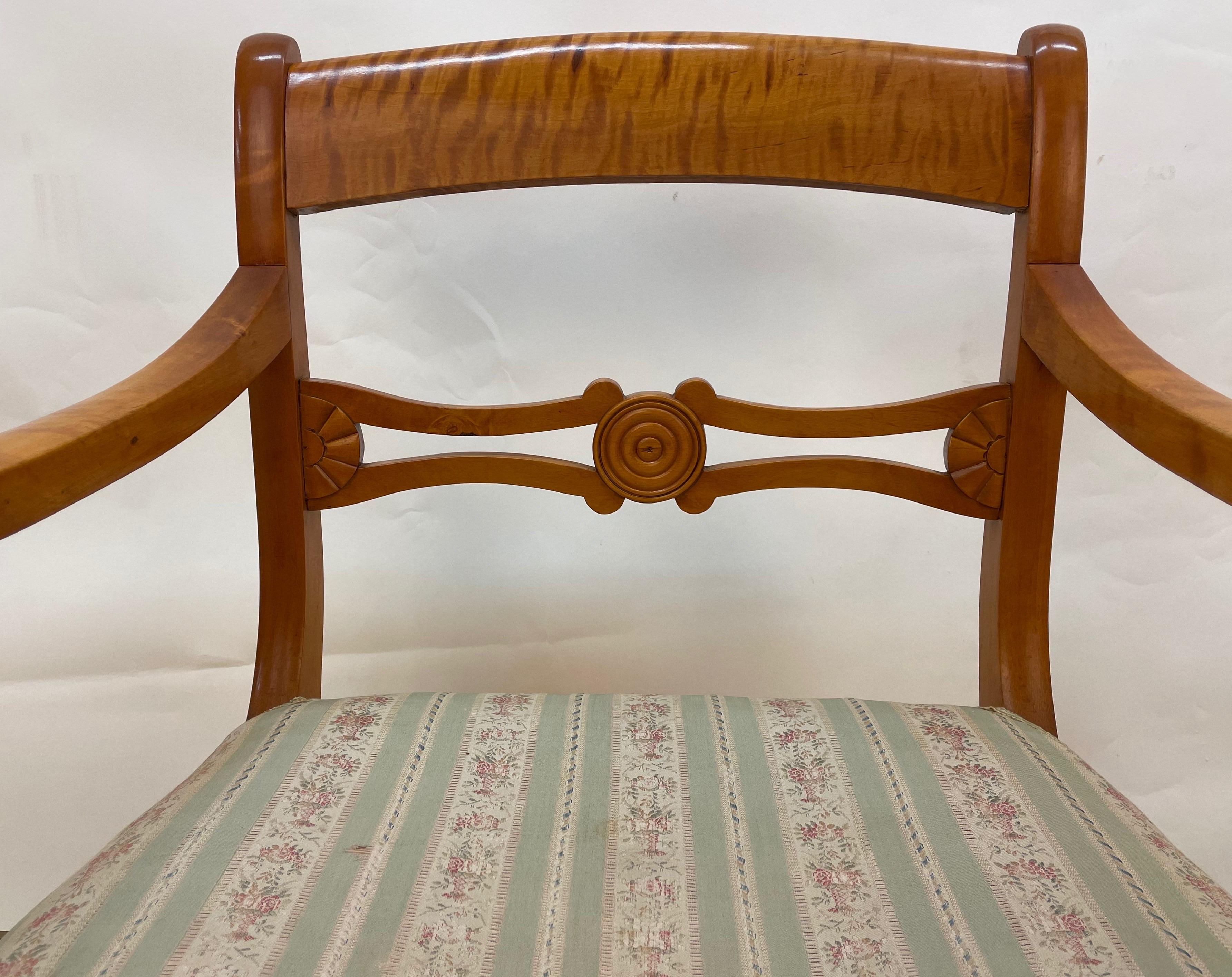 These graceful chairs were hand-made of golden nordic birch. In need of new fabric, this pair has otherwise aged beautifully. Over a hundred years old, these chairs will last a hundred more!