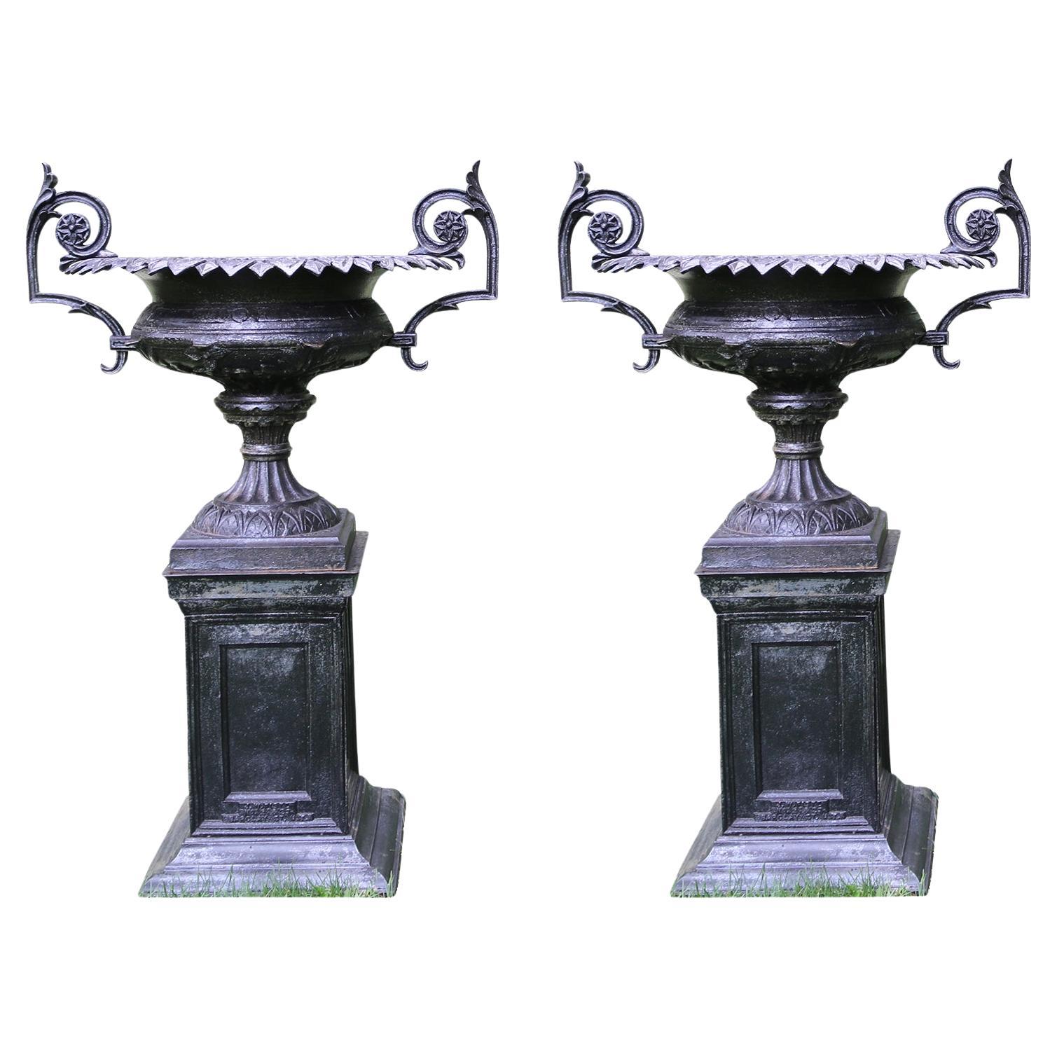 A Pair of Black Cast-Iron Urns by J.W. Fiske For Sale