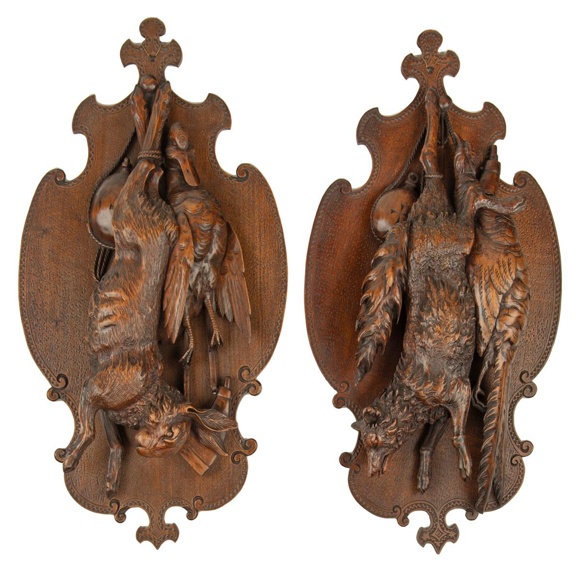 A pair of ‘Black Forest’ game plaques, one carved a fox and a pheasant, the other with a hare and duck.  Swiss, circa 1880.

According to Arenski, Daniels and Daniels, Swiss Carvings ‘The Art of the Black Forest’, 1820-1940, London 2004, pages 44,