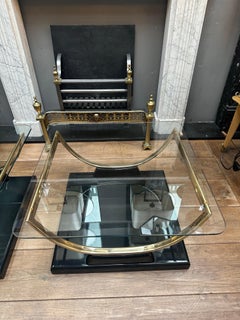 A Pair Of Black Lacquered And Brass End Tables