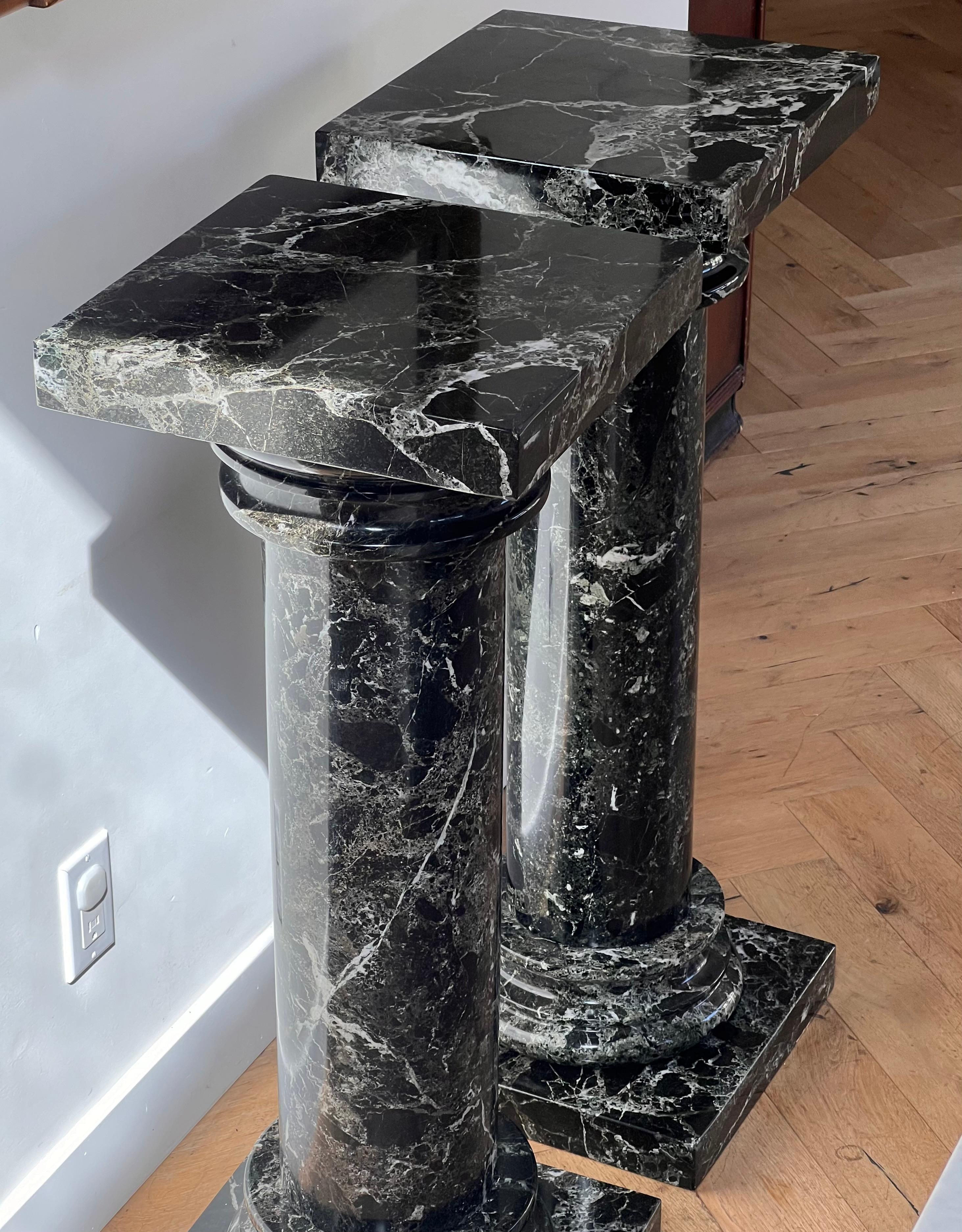 A pair of black marble pedestal columns, late 20th century 4